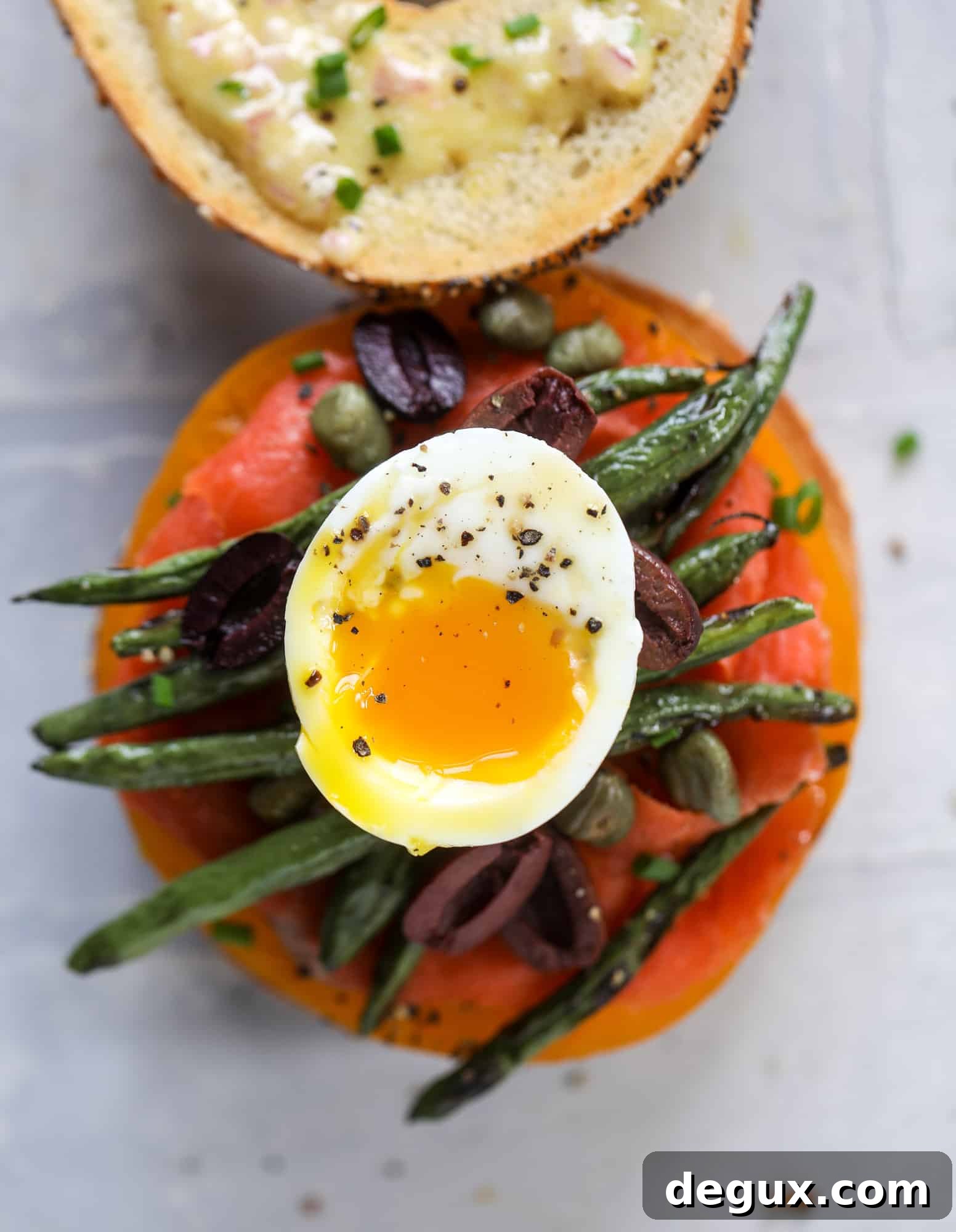 soft boiled egg on a nicoise bagel