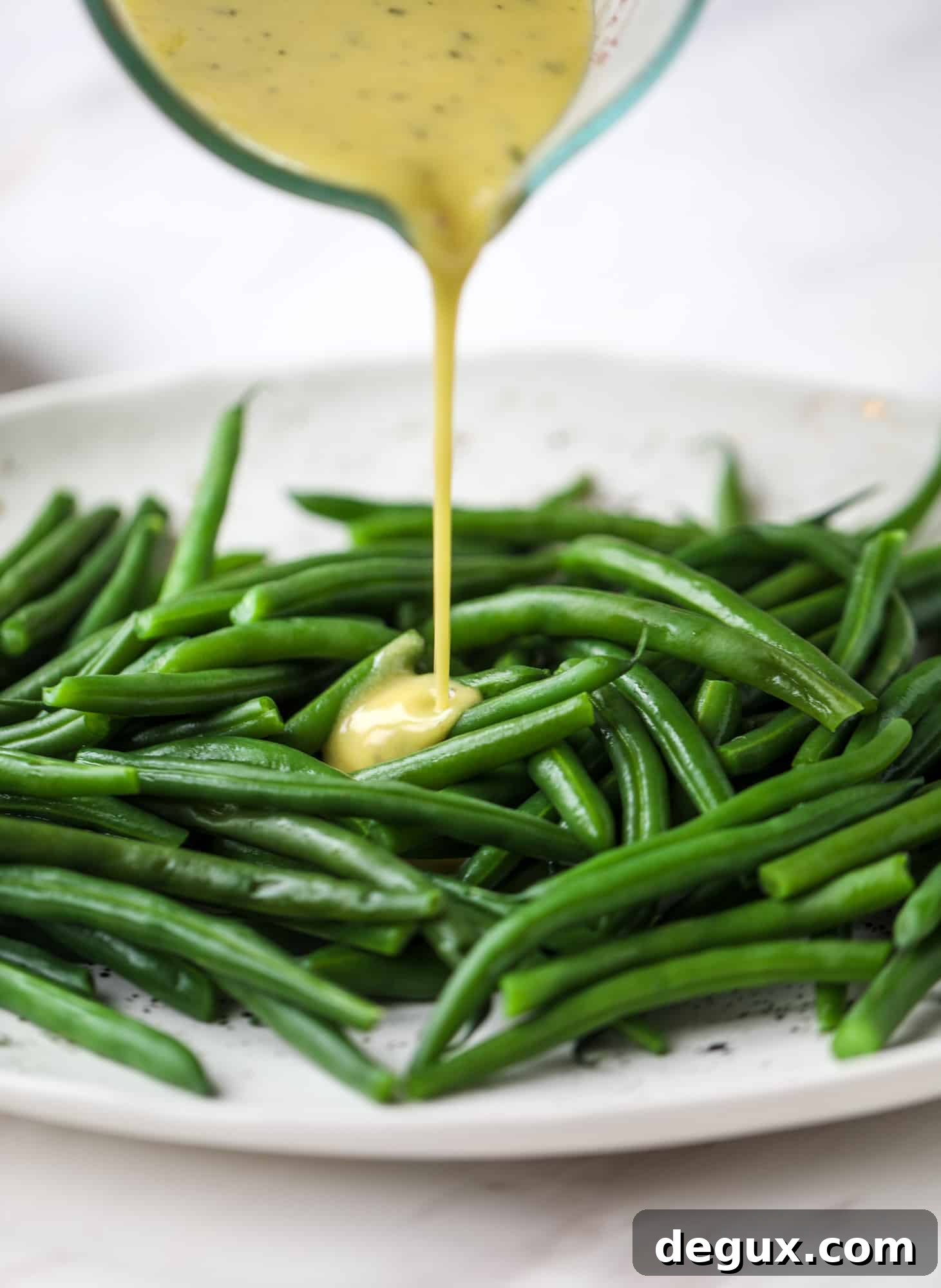 dijon vinaigrette on blanched green beans