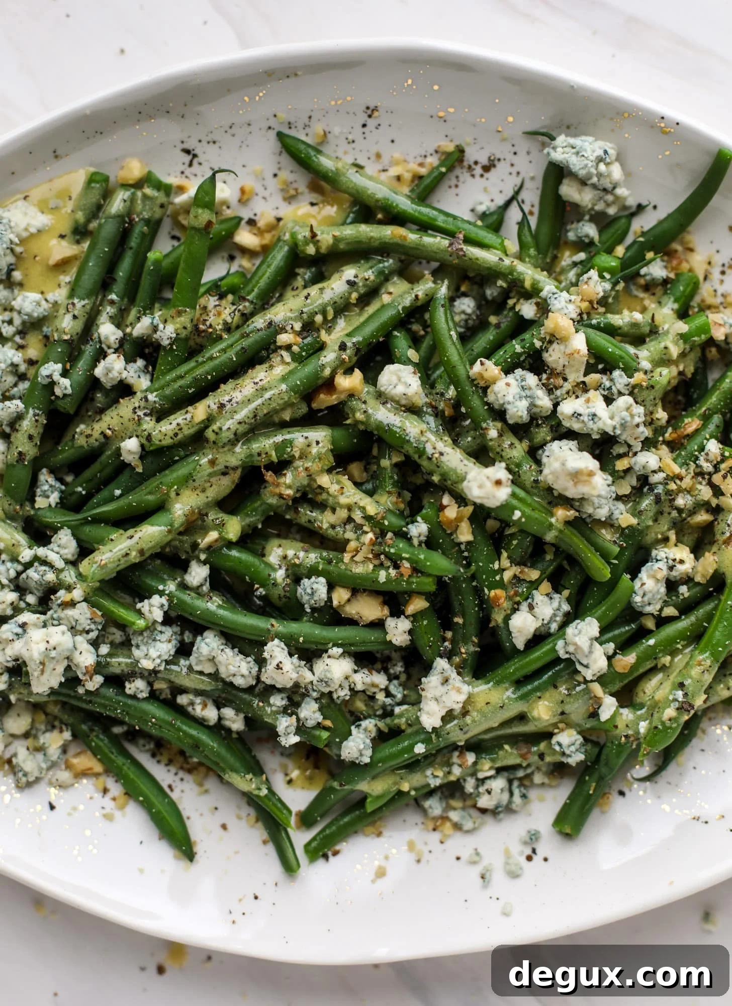 This fresh green bean salad is the ultimate summer side dish. Crisp green beans, creamy blue cheese, chopped walnuts and a dijon dressing. It's beyond!