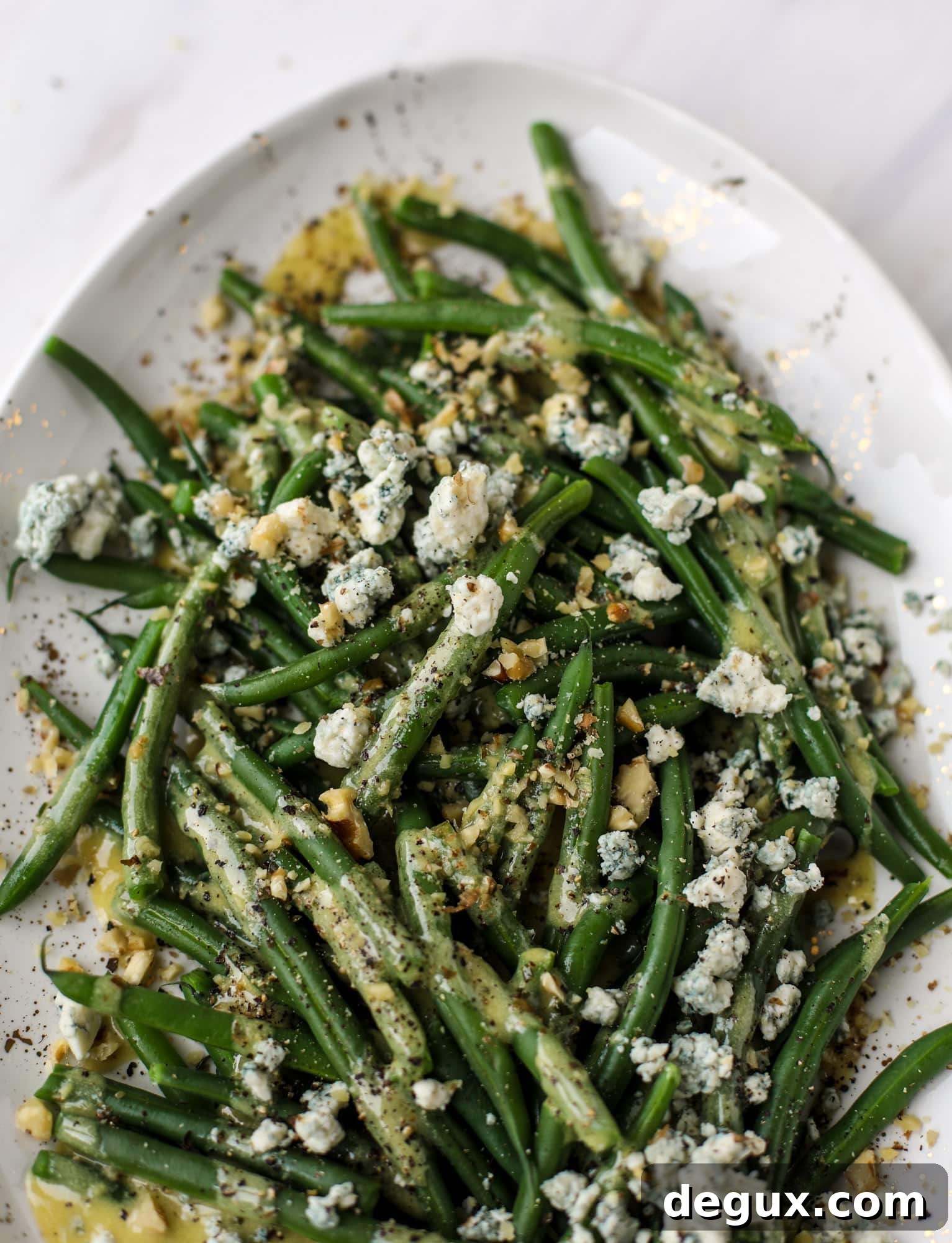 This fresh green bean salad is the ultimate summer side dish. Crisp green beans, creamy blue cheese, chopped walnuts and a dijon dressing. It's beyond!