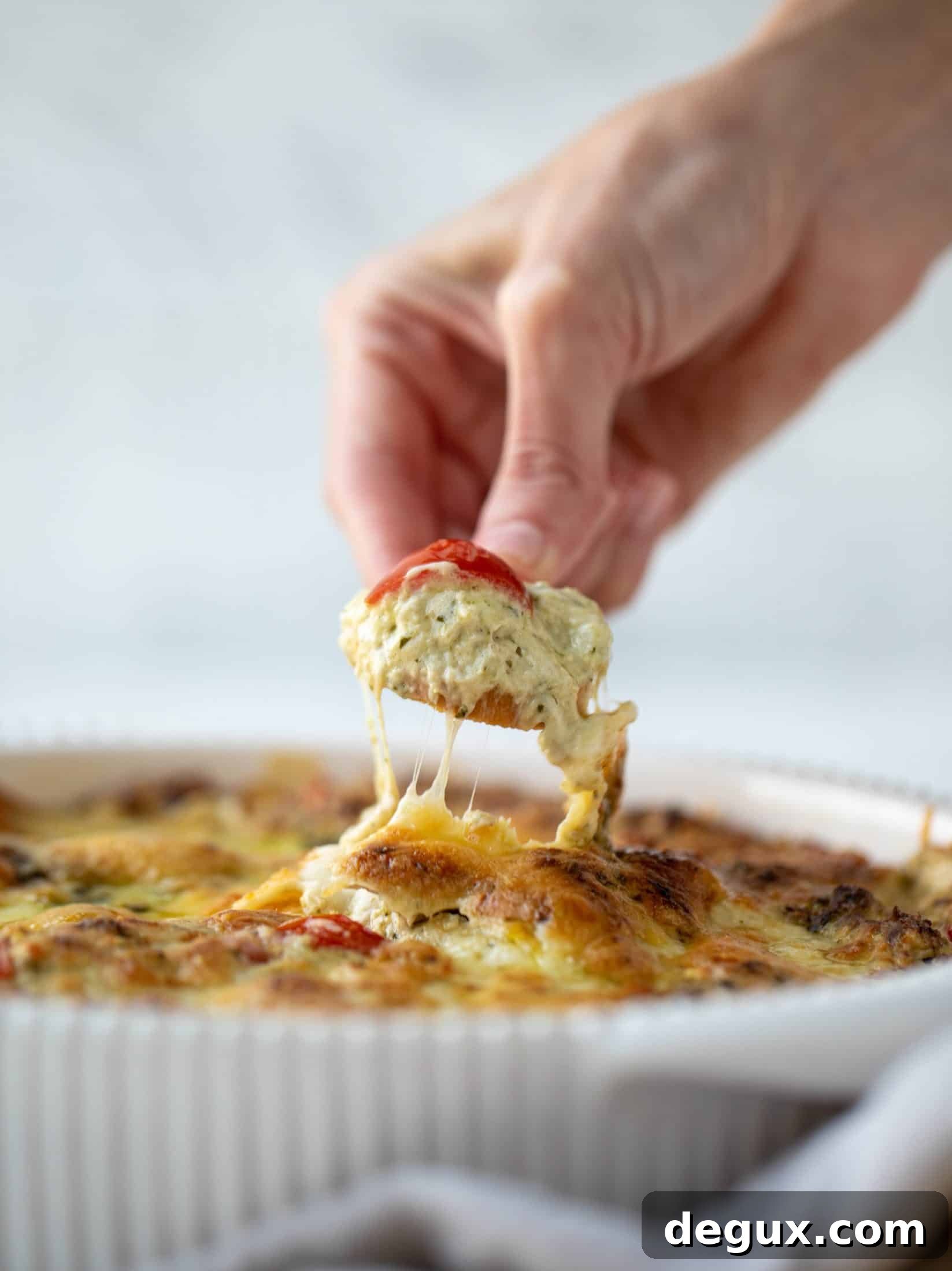 This cheesy pesto chicken dip is a great way to use up your end-of-summer herbs! Lots of delicious smoky flavor and tons of bubbly cheese.