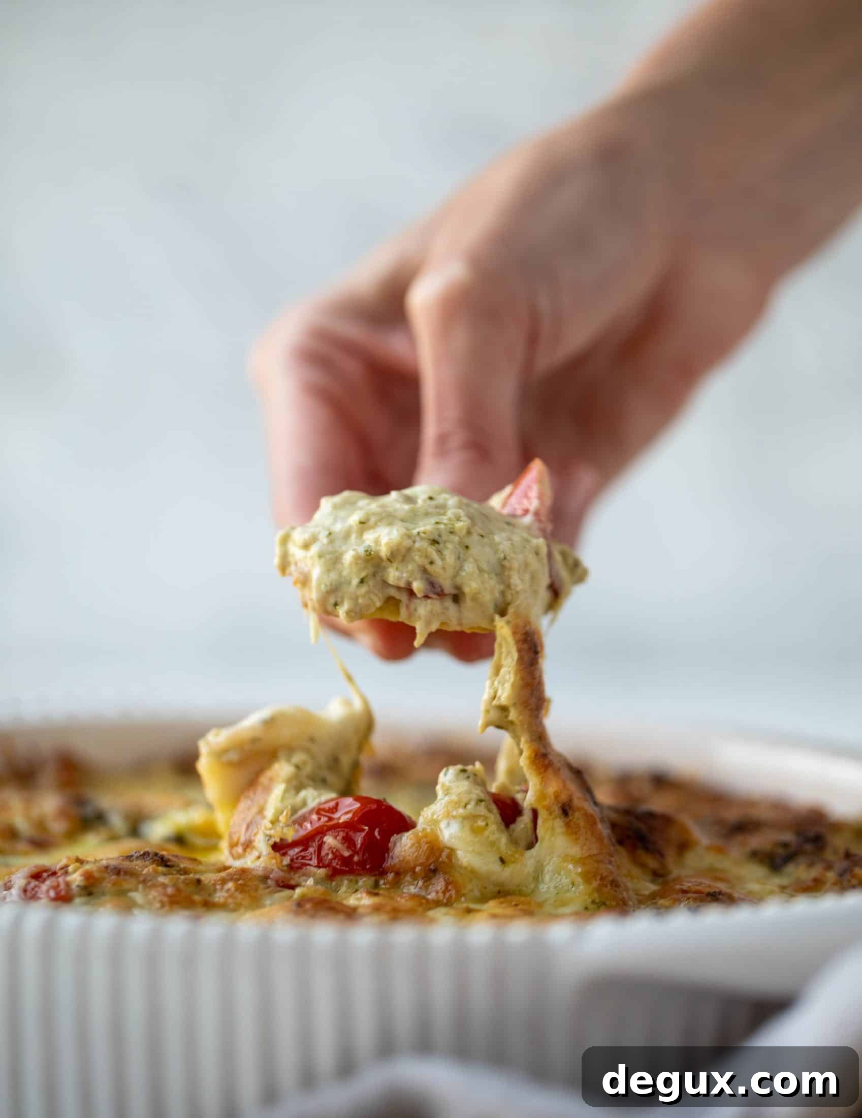This cheesy pesto chicken dip is a great way to use up your end-of-summer herbs! Lots of delicious smoky flavor and tons of bubbly cheese.