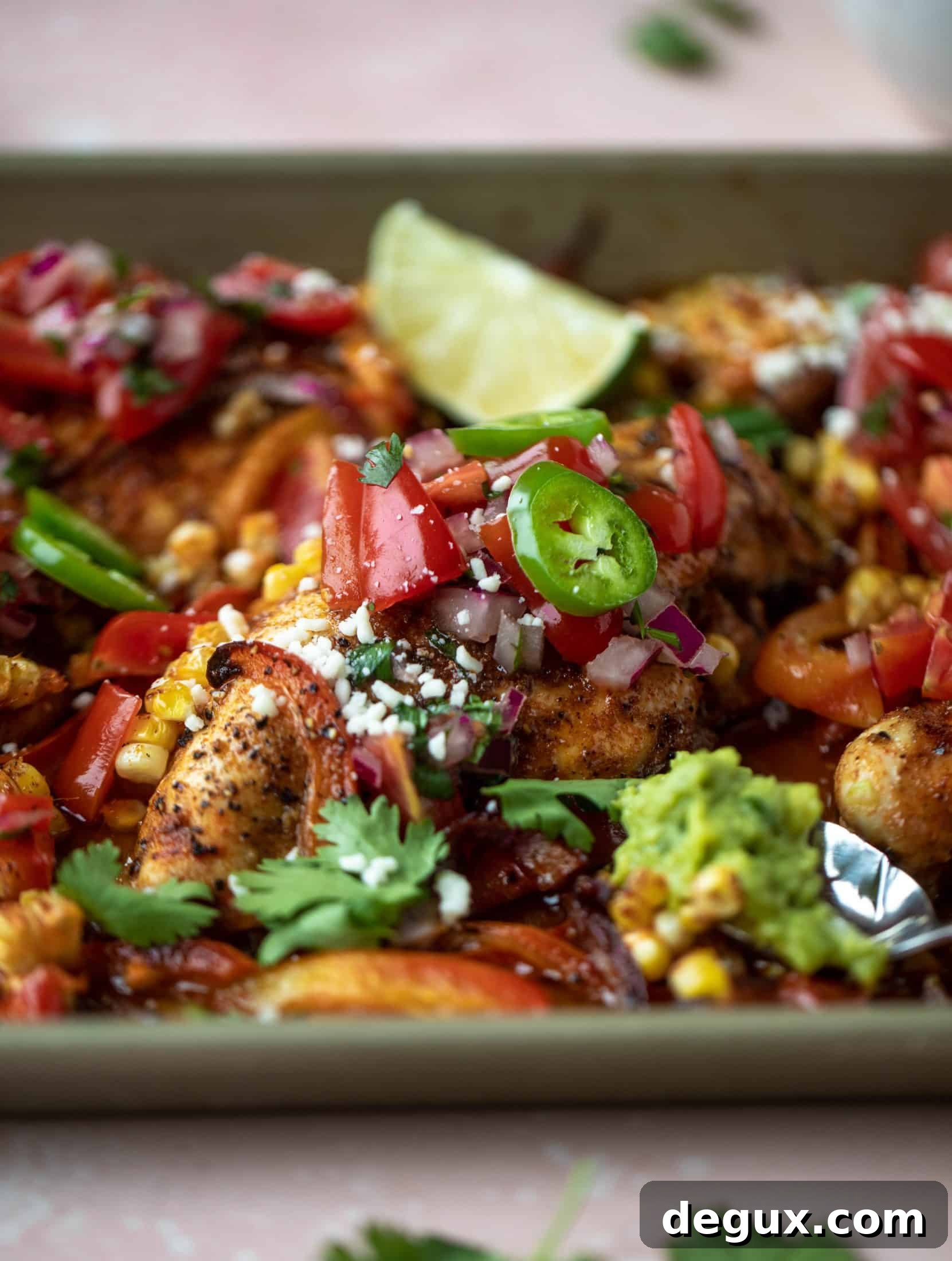 This sheet pan nacho chicken recipe results in the juiciest, more flavorful chicken that can be served in a multitude of ways!
