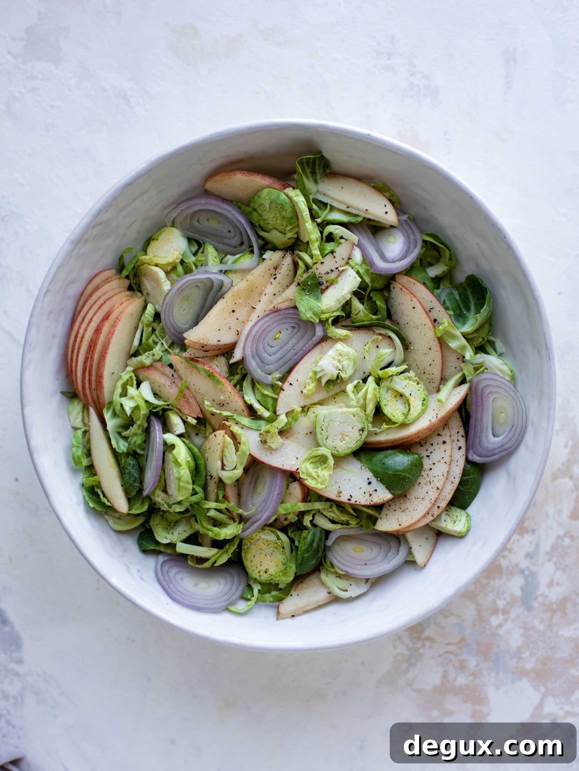 Crispy Brussels Sprout Salad with Brown Butter Vinaigrette 4 This crunchy brussels sprouts apple salad is filled with sprouts, apples, shallots, cinnamon toasted walnuts and drizzled with a brown butter dressing.