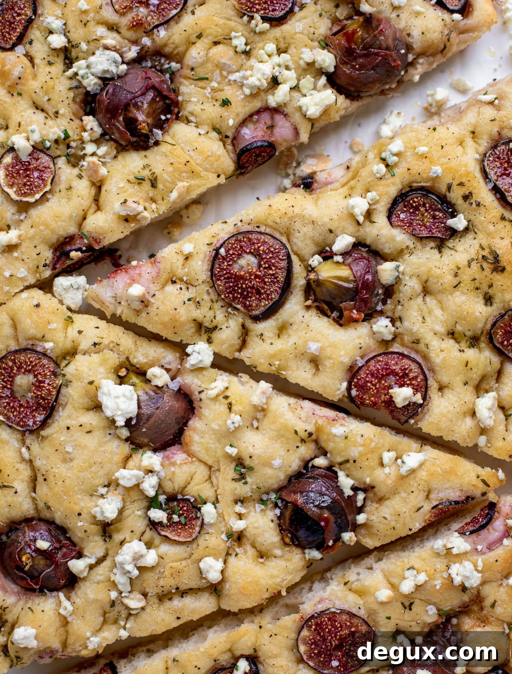 This stuffed fig focaccia bread is such an amazing way to use figs! Golden, toasty, salted focaccia studded with fig jewels. It's delicious and pretty!