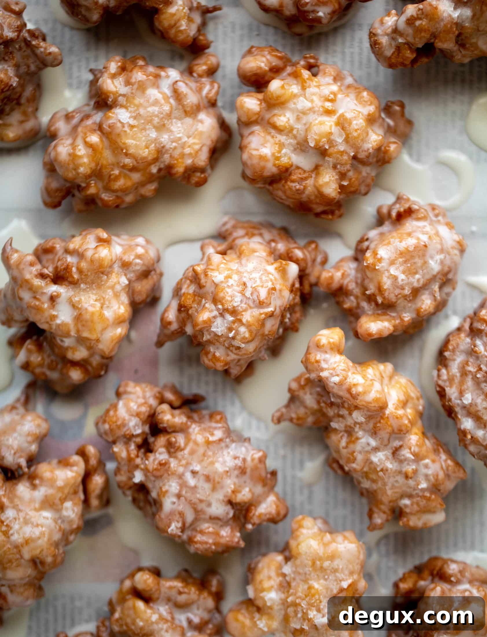 These salted apple fritters use honeycrisp apples and flaked sea salt for a fall flavor explosion. These are the best treat ever!