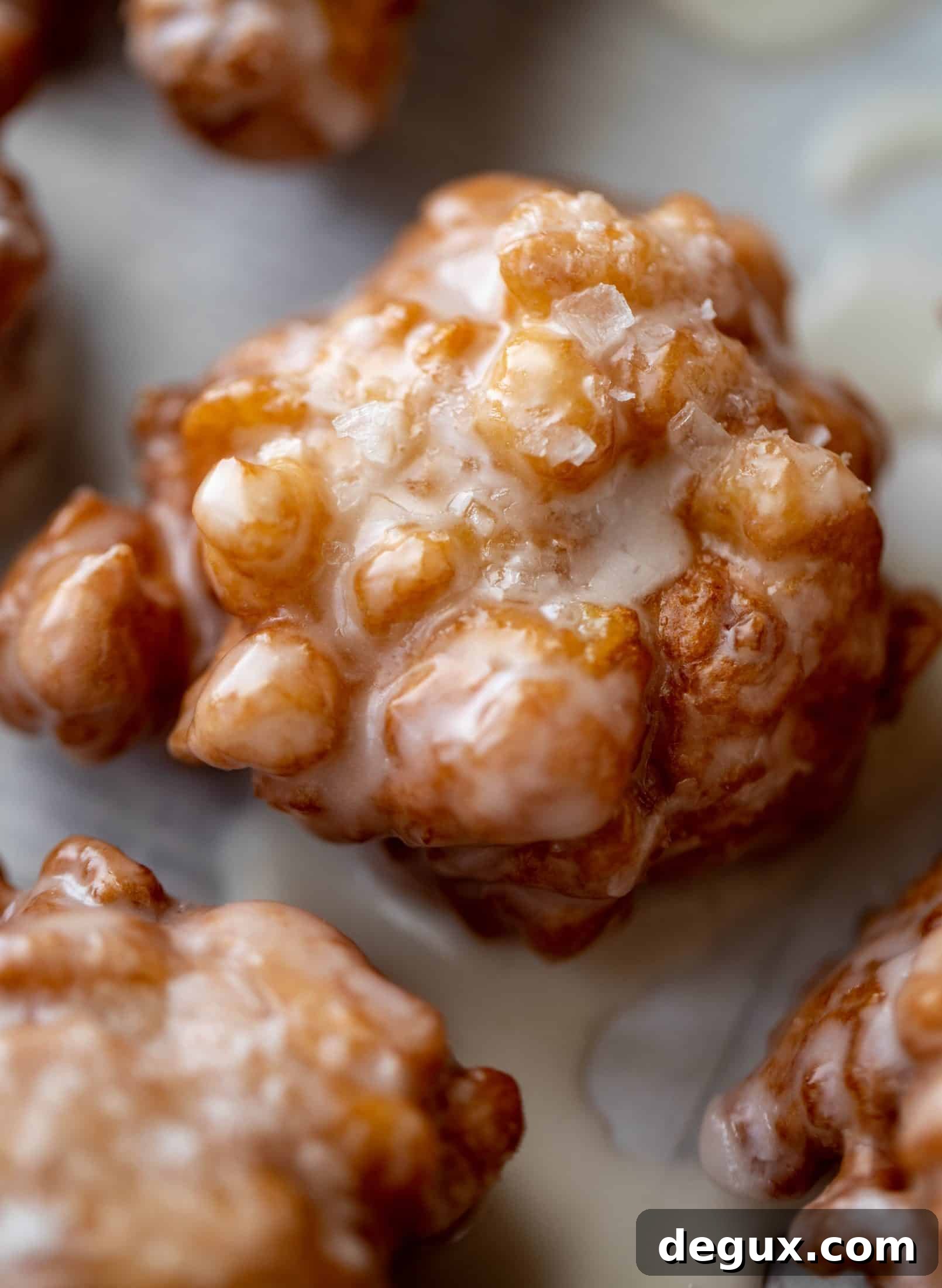 These salted apple fritters use honeycrisp apples and flaked sea salt for a fall flavor explosion. These are the best treat ever!