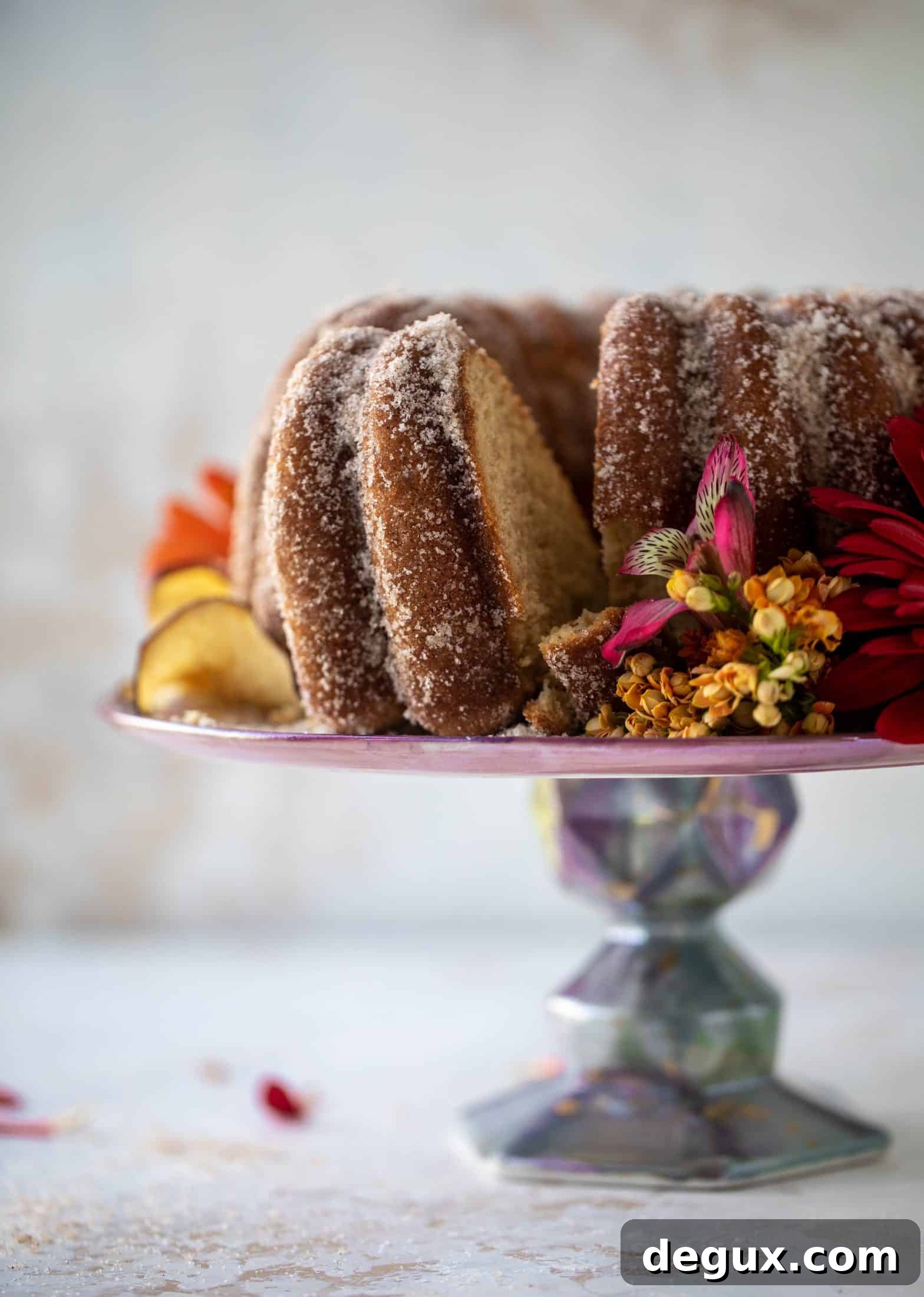 This apple cider donut cake is a huge fall crowd pleaser! Covered in cinnamon sugar and fluffy to perfection. It's incredible!