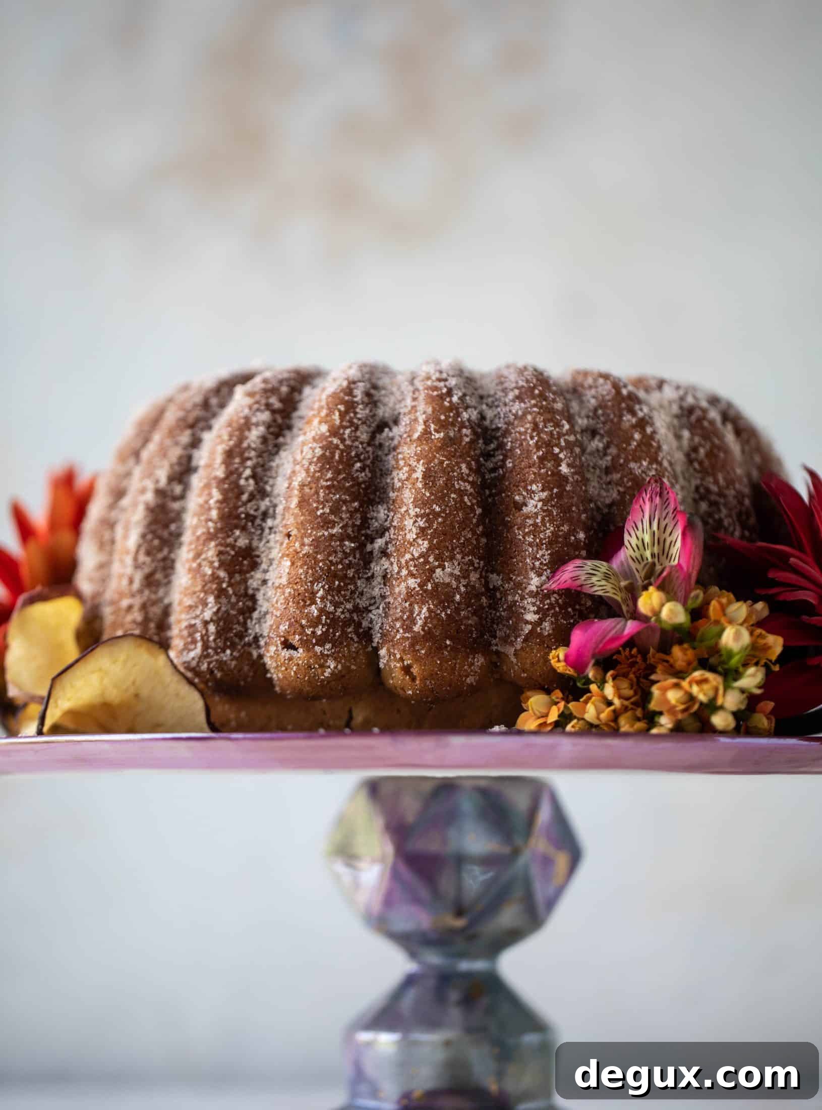 This apple cider donut cake is a huge fall crowd pleaser! Covered in cinnamon sugar and fluffy to perfection. It's incredible!