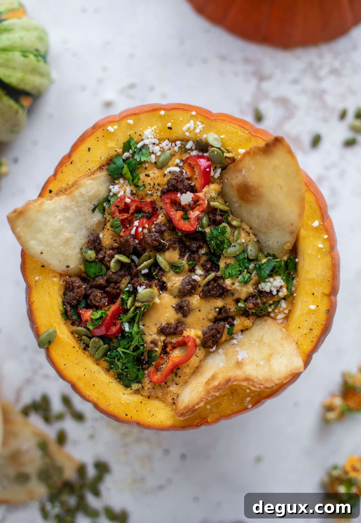 Pumpkin Queso Fundido Recipe: Creamy Autumn Dip for Parties 2 This pumpkin queso fundido is the perfect indulgence for fall. Warm pumpkin queso topped with chroizo, pepitas and jalapeños. It's delish!