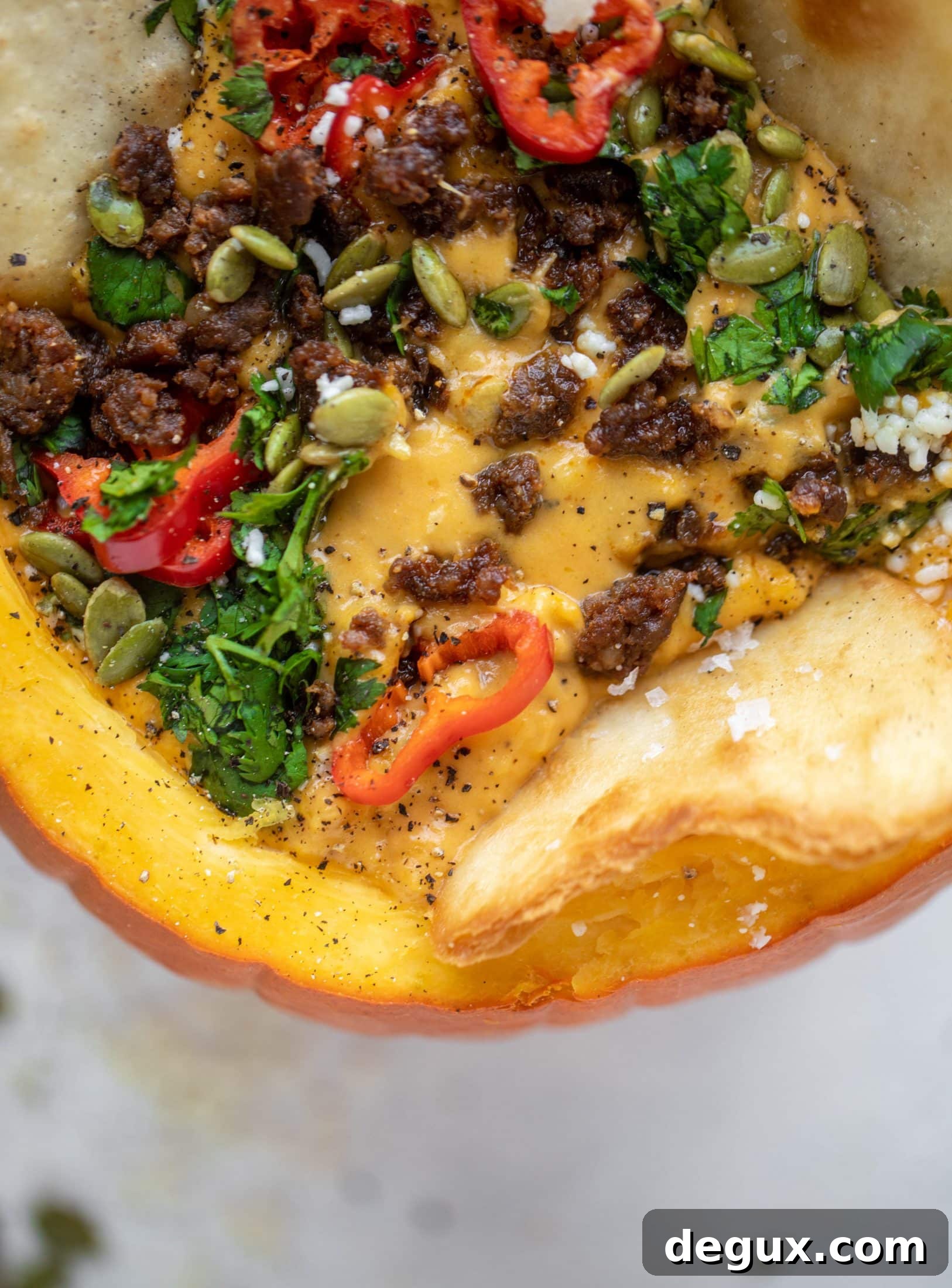 Pumpkin Queso Fundido Recipe: Creamy Autumn Dip for Parties 11 This pumpkin queso fundido is the perfect indulgence for fall. Warm pumpkin queso topped with chroizo, pepitas and jalapeños. It's delish!