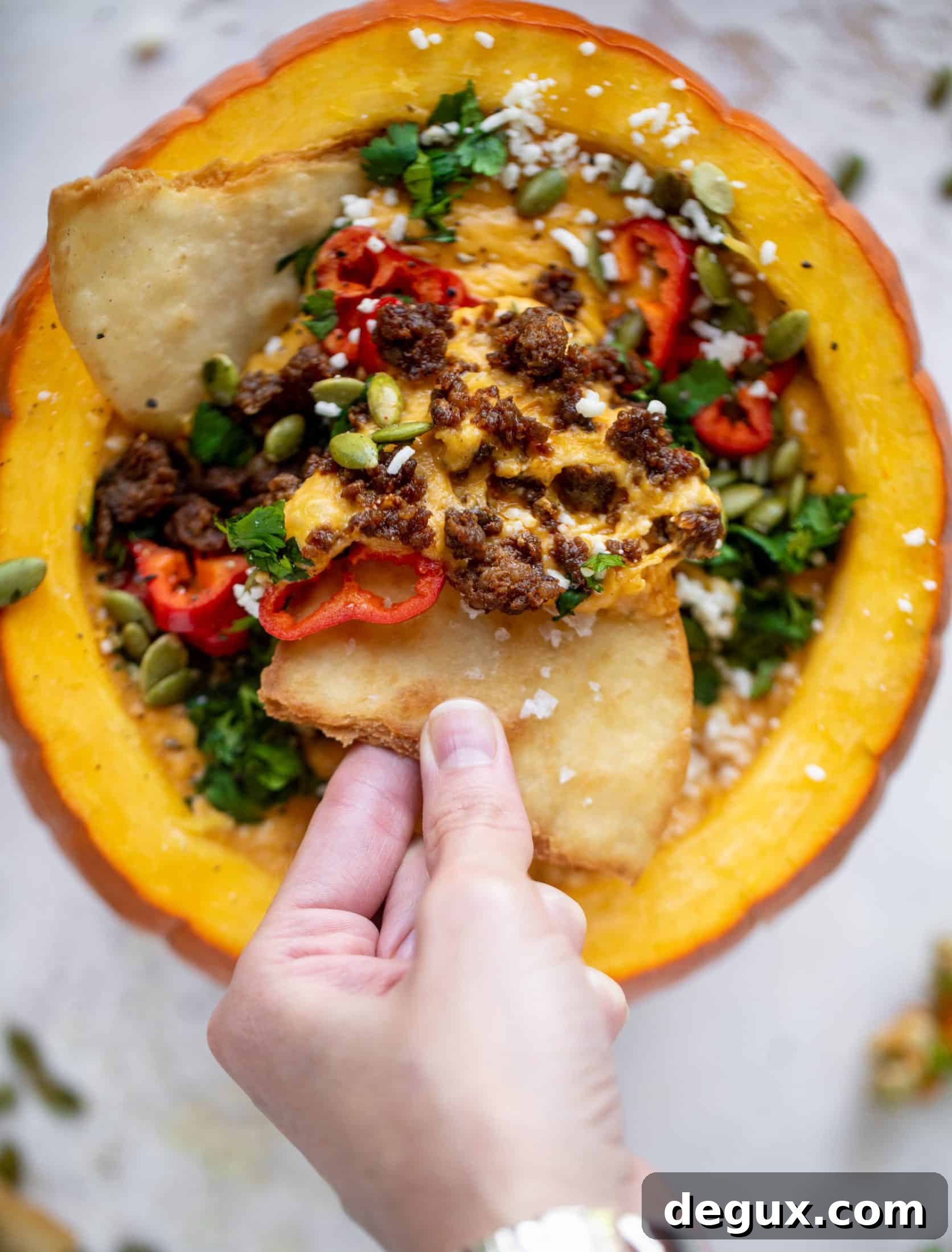 Pumpkin Queso Fundido Recipe: Creamy Autumn Dip for Parties 7 This pumpkin queso fundido is the perfect indulgence for fall. Warm pumpkin queso topped with chroizo, pepitas and jalapeños. It's delish!