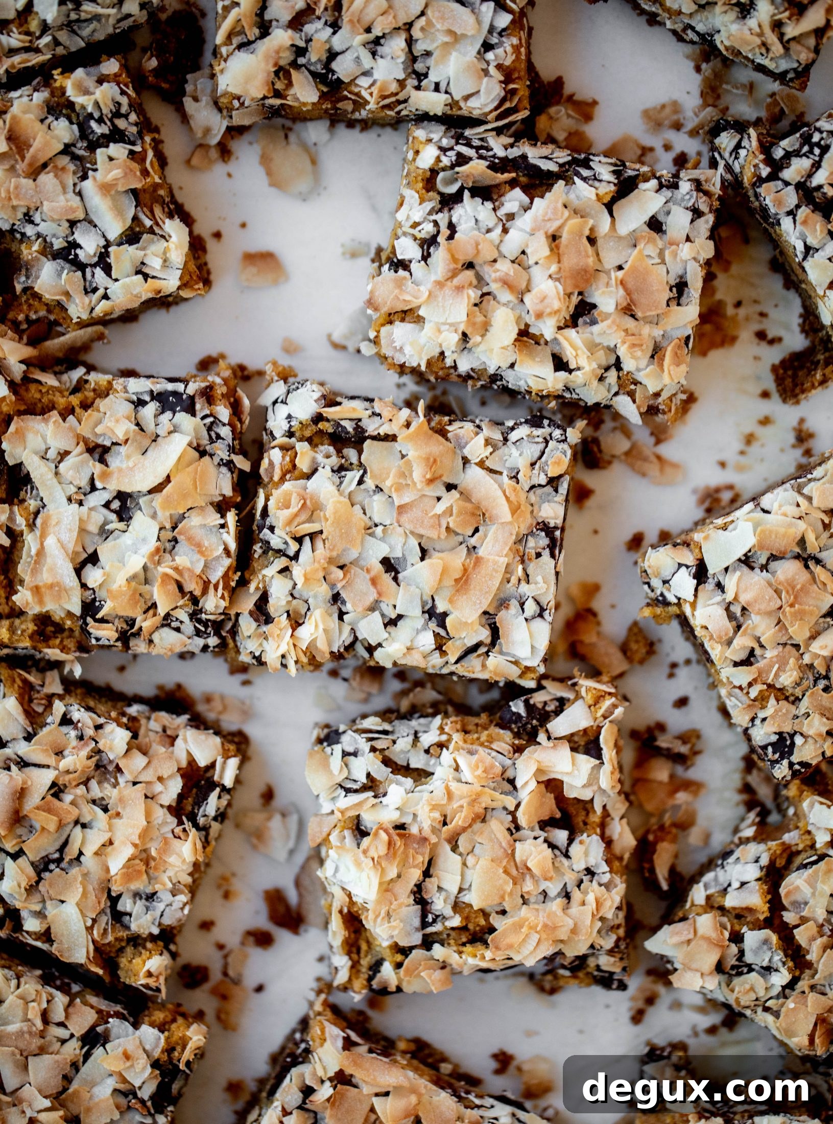 Pumpkin gooey bars are a decadent chocolate, coconut and pumpkin dessert! Crunchy graham crust, gooey pumpkin center and a crisp topping. Yum!
