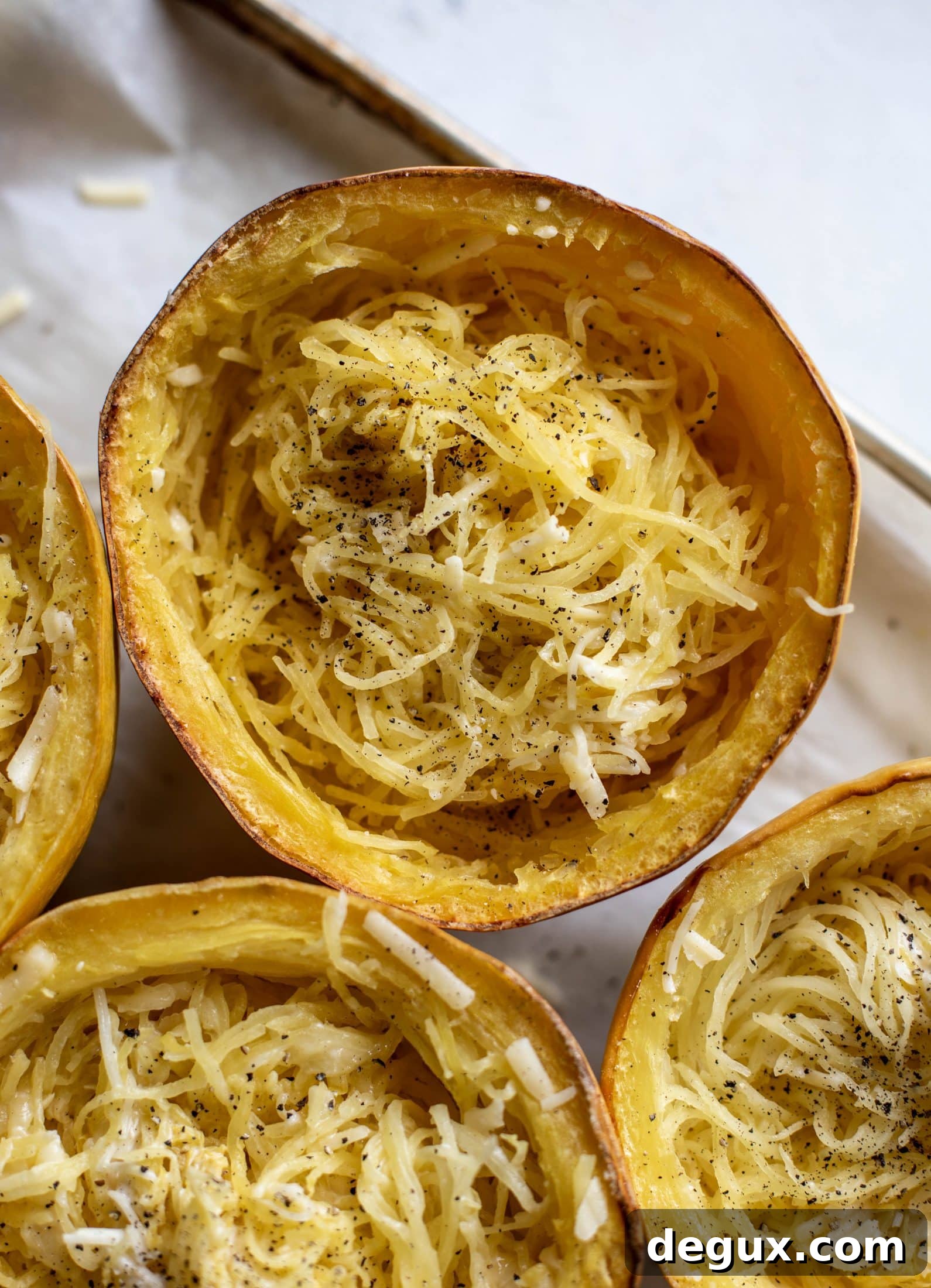 Three-Cheese Spaghetti Squash Bake: Creamy, Savory Dinner 5 Three cheese spaghetti squash in a squash bowl! Squash tossed with fontina, gruyere and parmesan to make a creamy comforting meal.