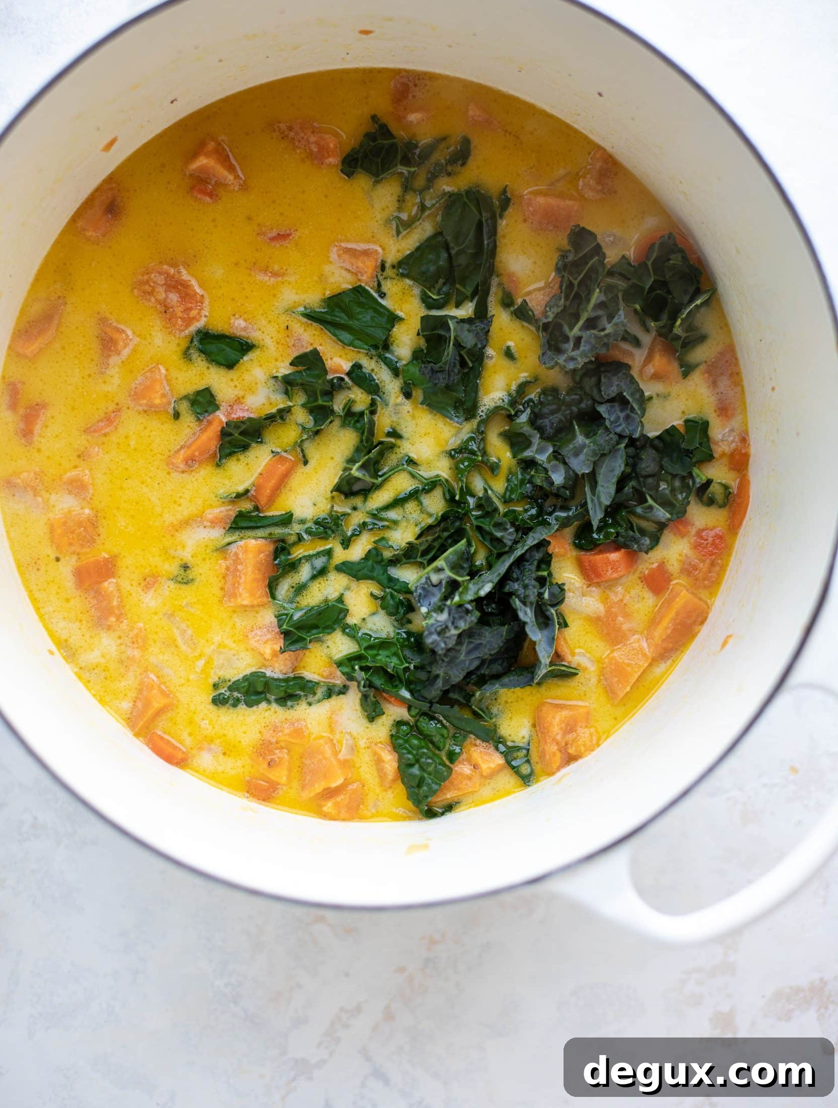 This sweet potato chowder is a hug in a bowl! Made with lots of greens and crunchy pancetta and pepitas for topping, it's a perfect weeknight meal.