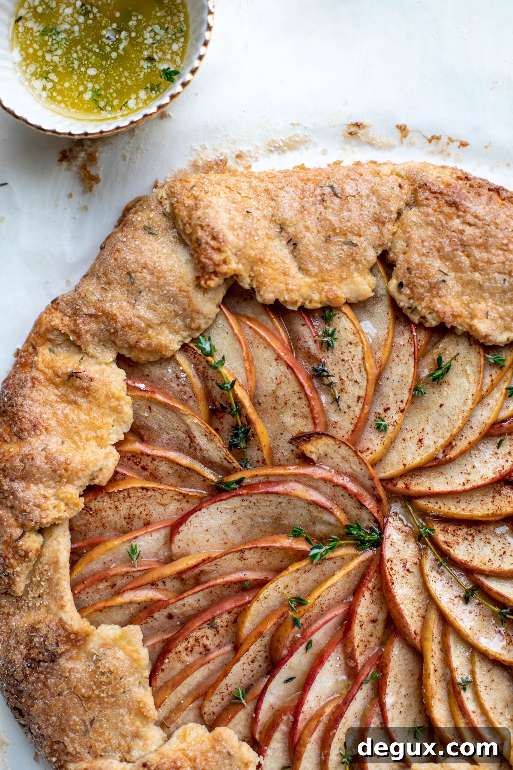 Honeycrisp Apple Galette with Cheddar Crust and Thyme Butter 2 This apple cheddar galette is made with honeycrisp apples, set in a cheddar herb crust and brushed with thyme butter! So delicious and perfect for fall.