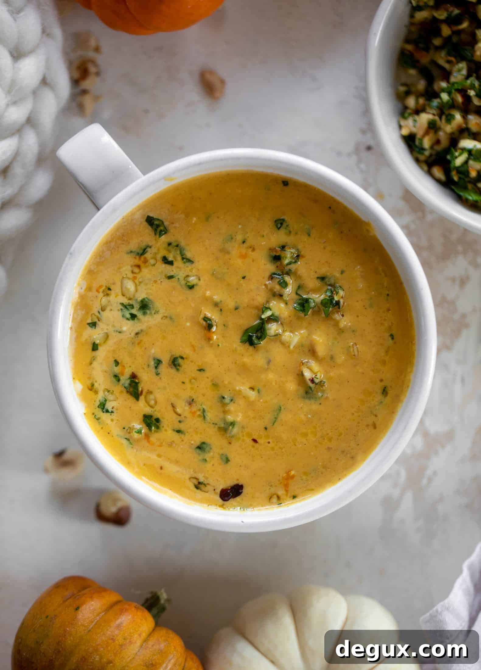 Roasted Pumpkin Soup with Hazelnut Gremolata 7 This pumpkin cream soup is silky smooth and delicious, then topped with a roasted hazelnut gremolata for extra flavor and crunch!