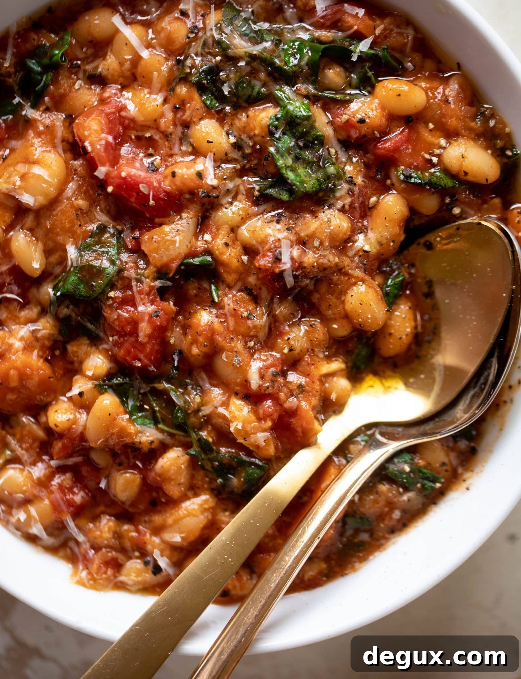 Tuscan Tomato, White Bean & Kale Soup Recipe 7 This tuscan tomato bread soup is super hearty, satisfying and delicious! Leftovers are a hit and you will find yourself craving this in the cooler months.