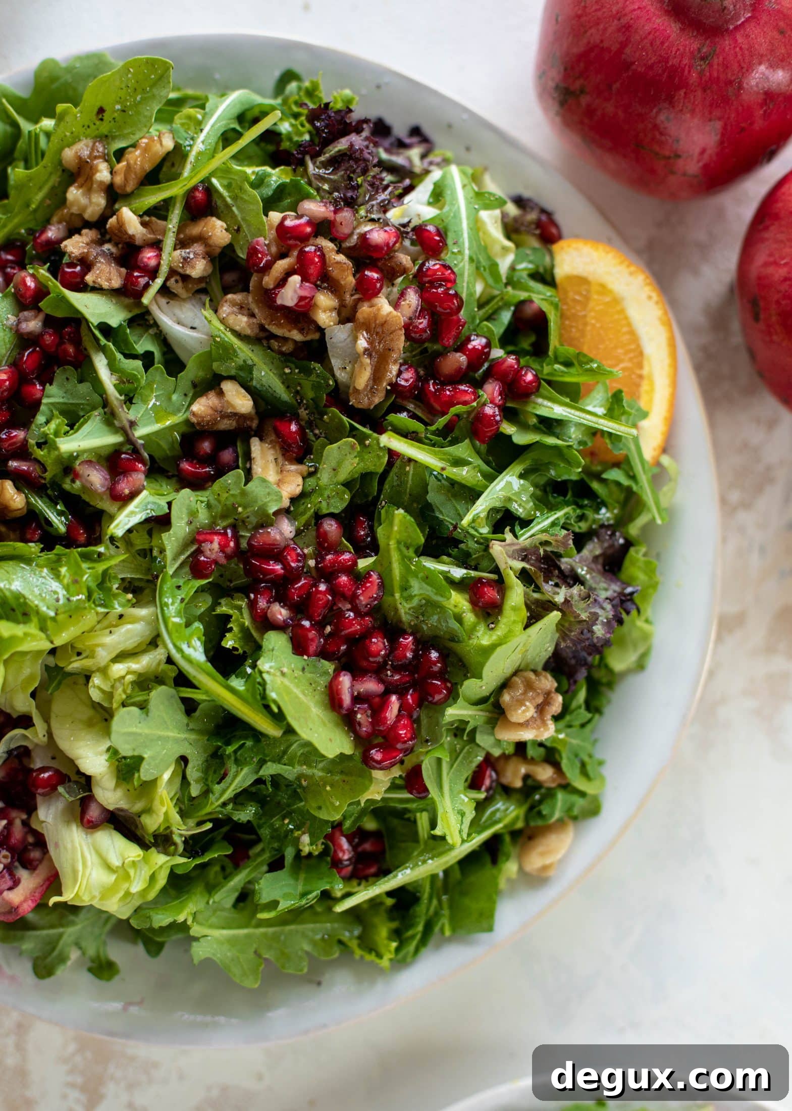 A pomegranate halloumi salad that's the perfect starter to your holiday meal! Drizzle with a spiced orange vinaigrette for the most festive flavor ever.