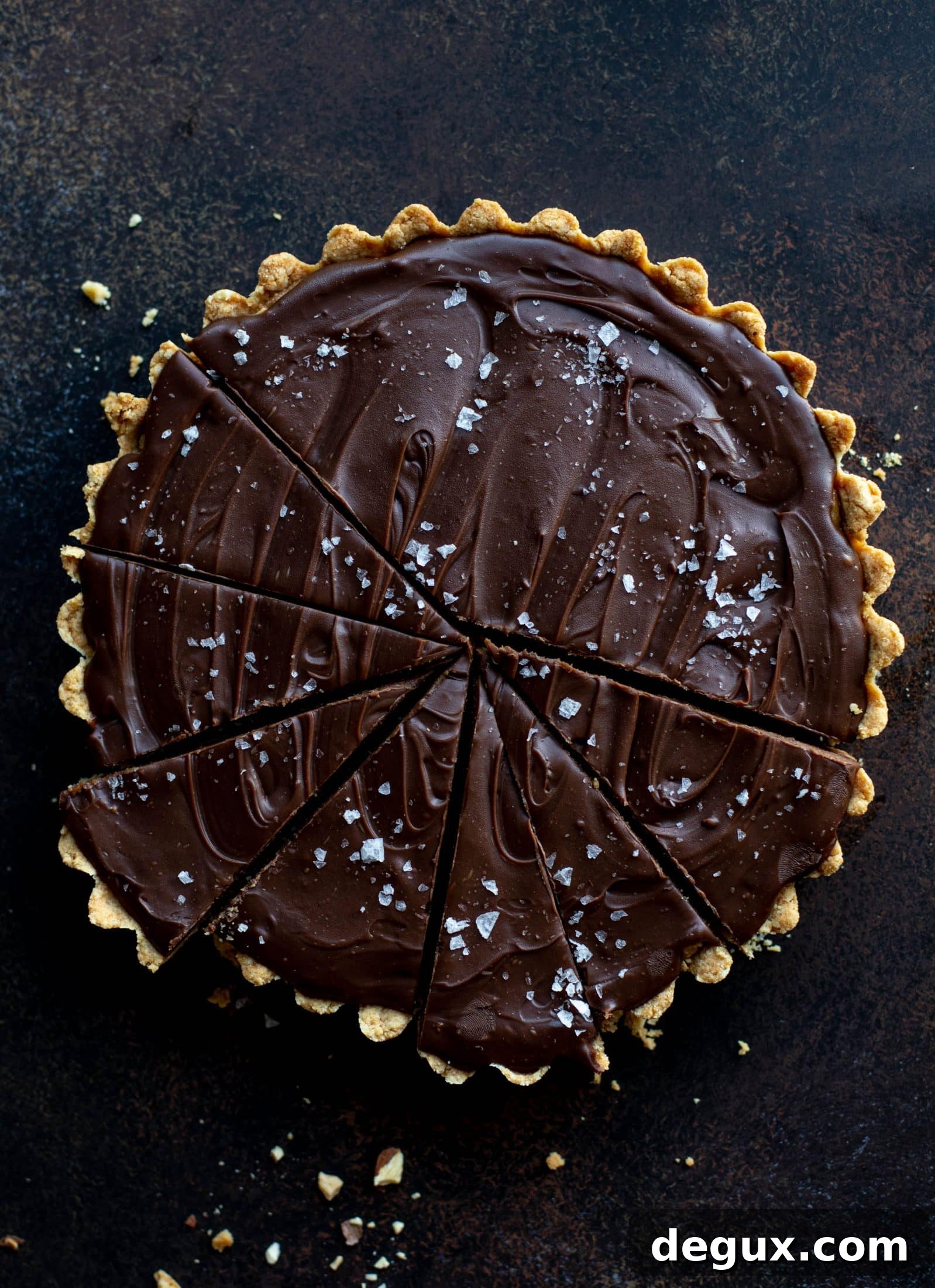 This snickers almond tart is made with an almond crust, homemade almond butter caramel and a chocolate ganache. It's to die for!