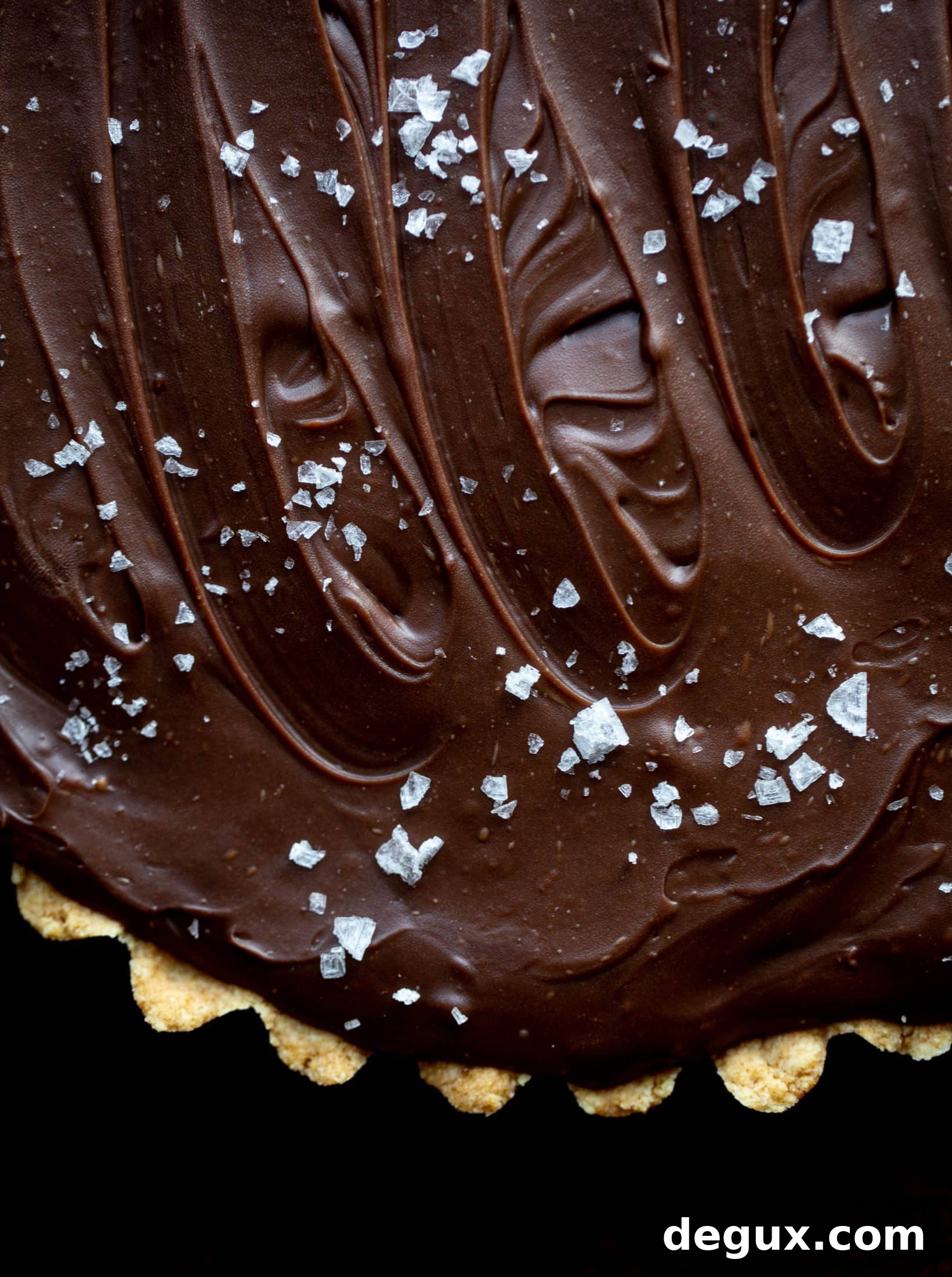 This snickers almond tart is made with an almond crust, homemade almond butter caramel and a chocolate ganache. It's to die for!