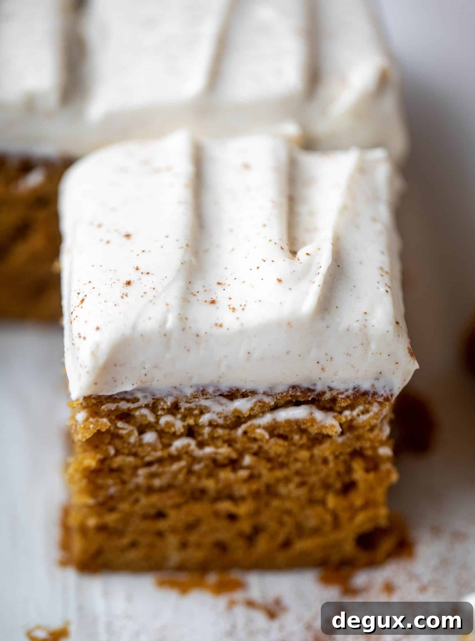 This pumpkin sheet cake is a legit pumpkin dream cake! It's so moist and fluffy and flavorful. With a blanket of cinnamon cream cheese frosting!