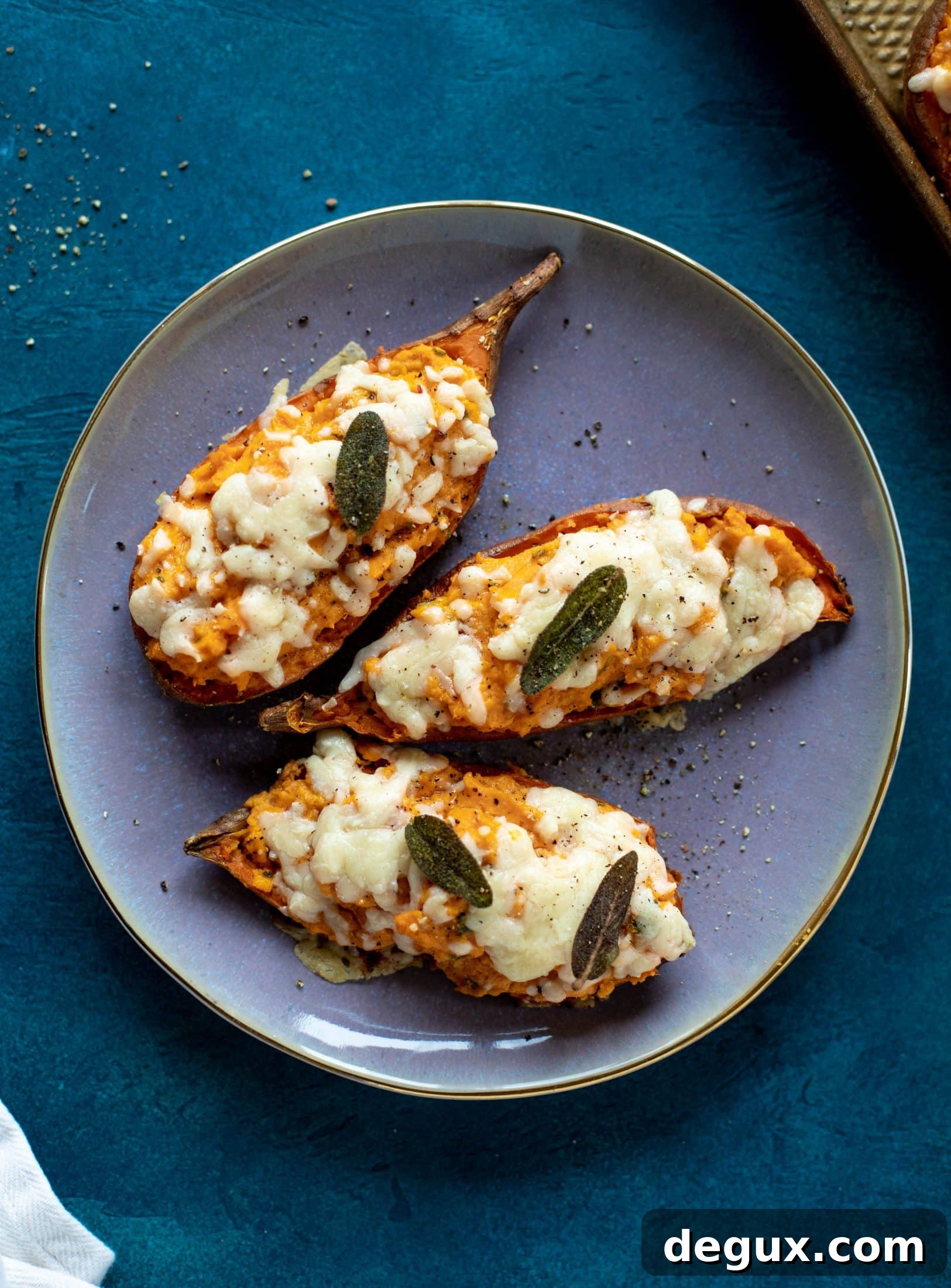 Twice-Baked Sweet Potatoes with Pumpkin, Sage & Brown Butter 9 These twice baked sweet potatoes are whipped with crispy sage and pumpkin puree! Topped with cheese and baked until melty, they are super delish.