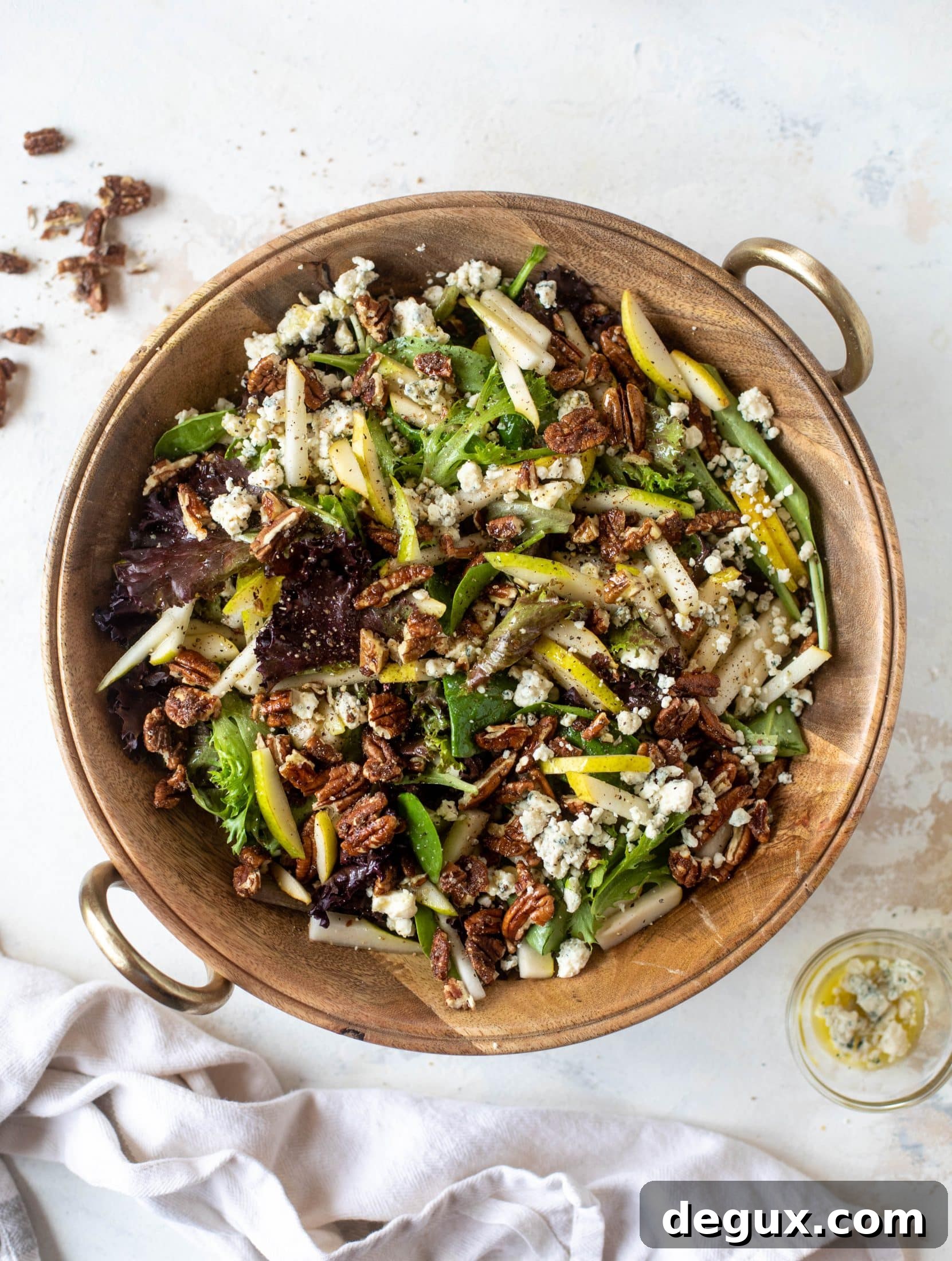Holiday Pear, Gorgonzola & Sweet-Spiced Pecan Salad Recipe 5 This pear gorgonzola is the perfect simple greens salad for the holiday and winter season! Topped with sweet and spicy pecans and champagne vinaigrette!