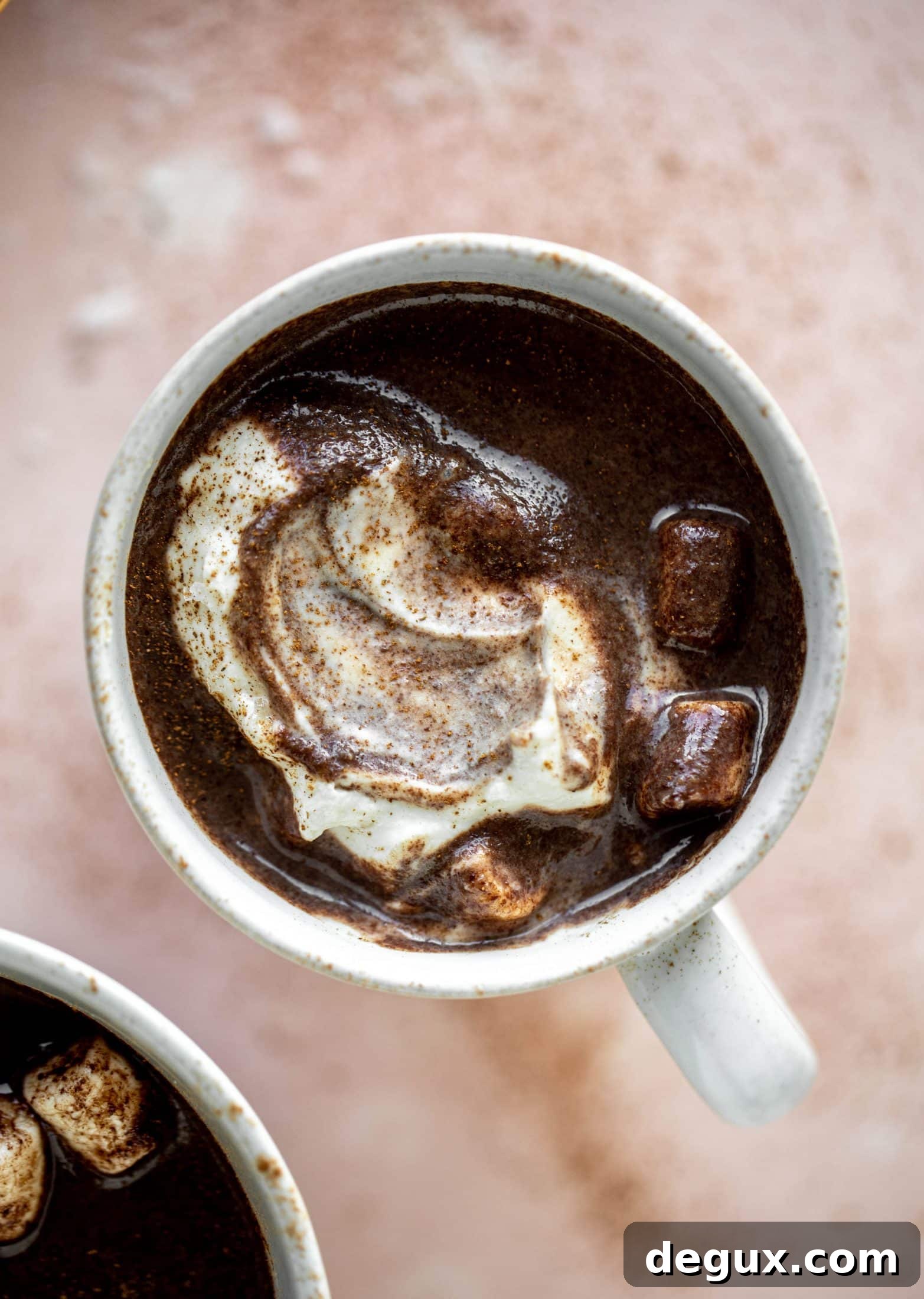 This salted peanut butter hot chocolate is a hug in a mug! It's super decadent, indulgent and cozy. Everyone's favorite flavors in one drink!