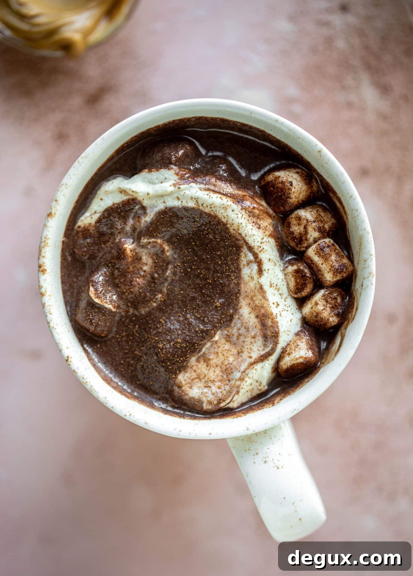 This salted peanut butter hot chocolate is a hug in a mug! It's super decadent, indulgent and cozy. Everyone's favorite flavors in one drink!