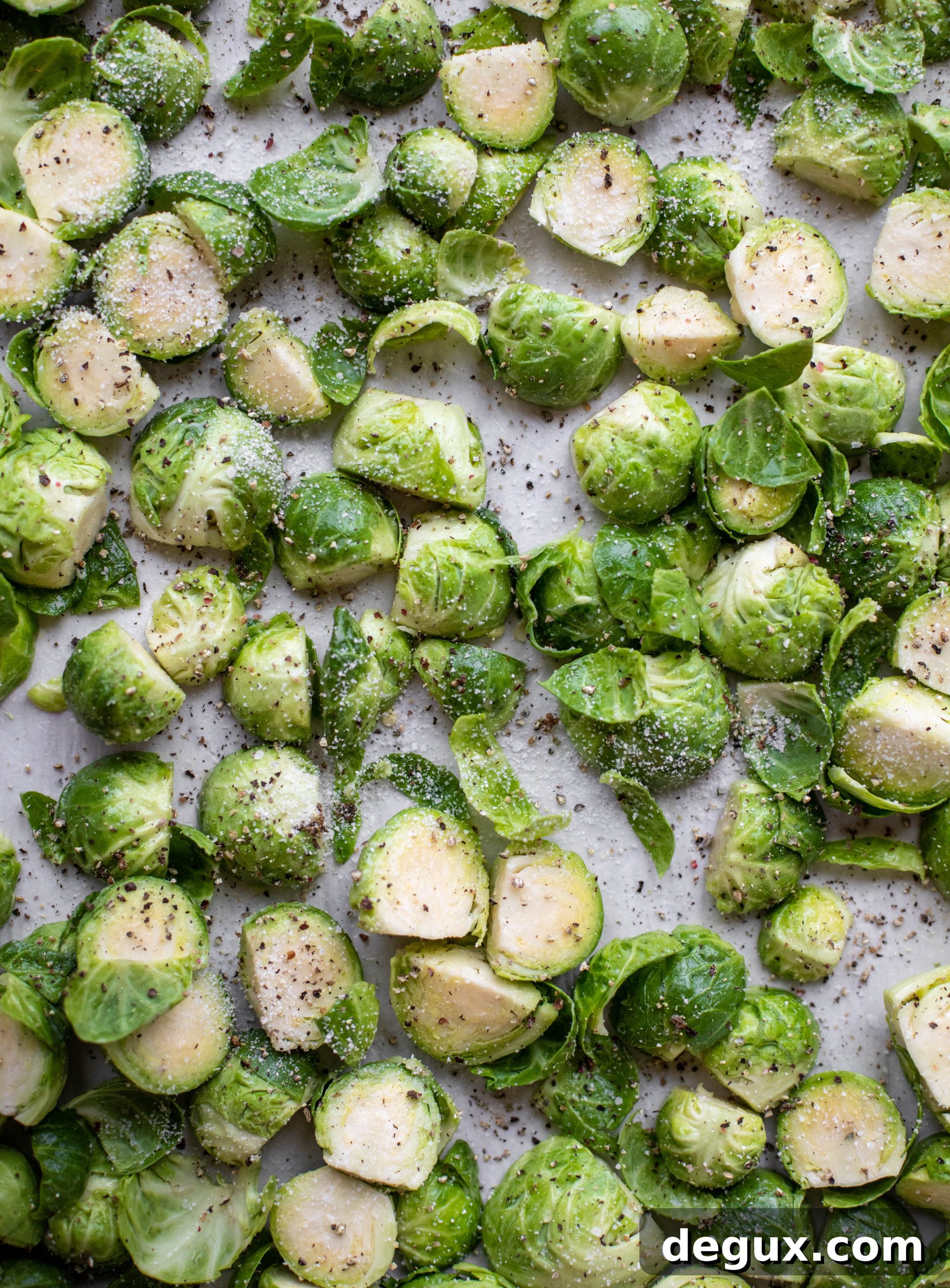 This cacio e pepe brussels are out of the world. Roasted until crisp, topped with tons of black pepper and salty pecorino cheese. Yum.