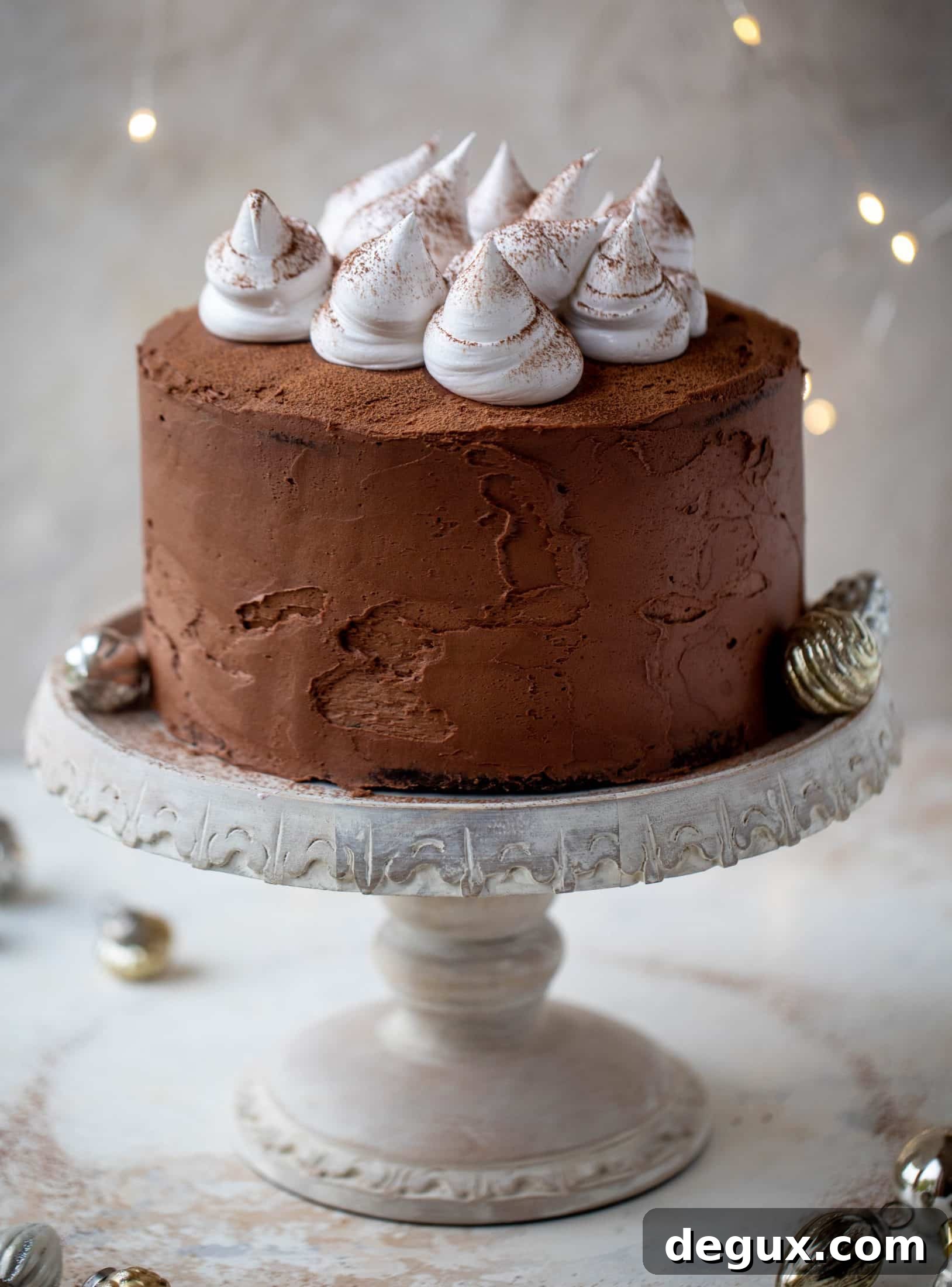 Hot Cocoa Cake with Whipped Marshmallow Frosting 12 This hot cocoa cake is made with the fudgiest chocolate cake, smothered in chocolate cream cheese frosting and dolloped with whipped marshmallow!