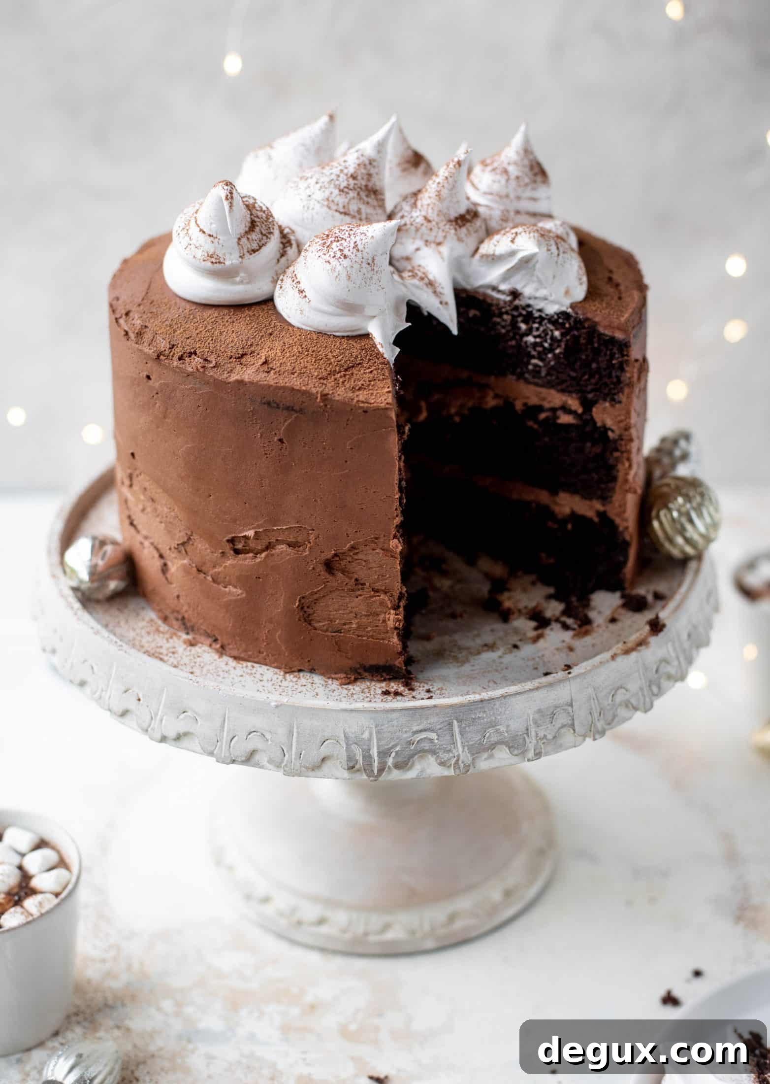 Hot Cocoa Cake with Whipped Marshmallow Frosting 10 This hot cocoa cake is made with the fudgiest chocolate cake, smothered in chocolate cream cheese frosting and dolloped with whipped marshmallow!