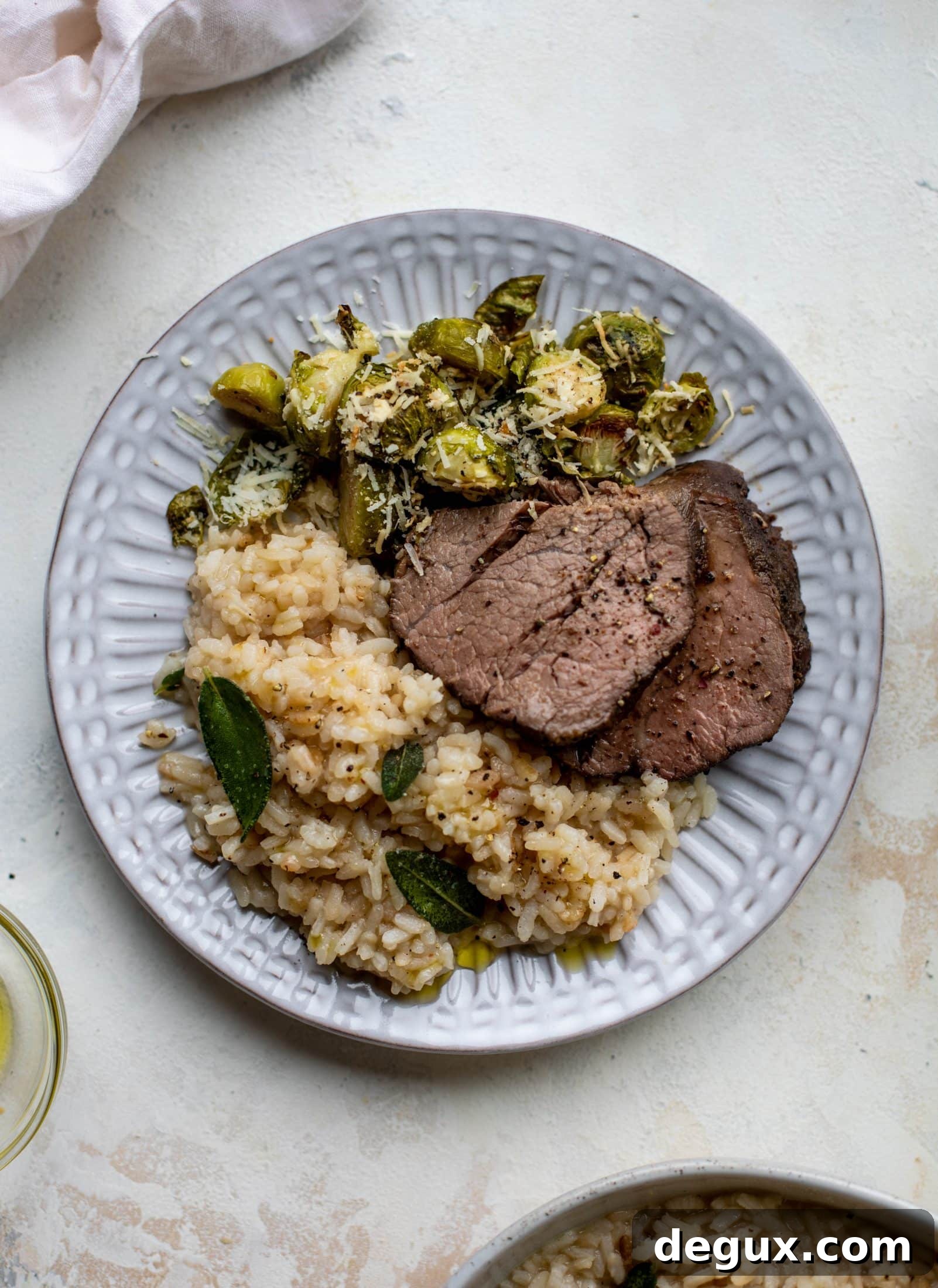 The ultimate special occasion meal! Espresso crusted filet paired with truffle sage risotto and cacio e pepe brussels. So much flavor - it's perfect for the holidays!