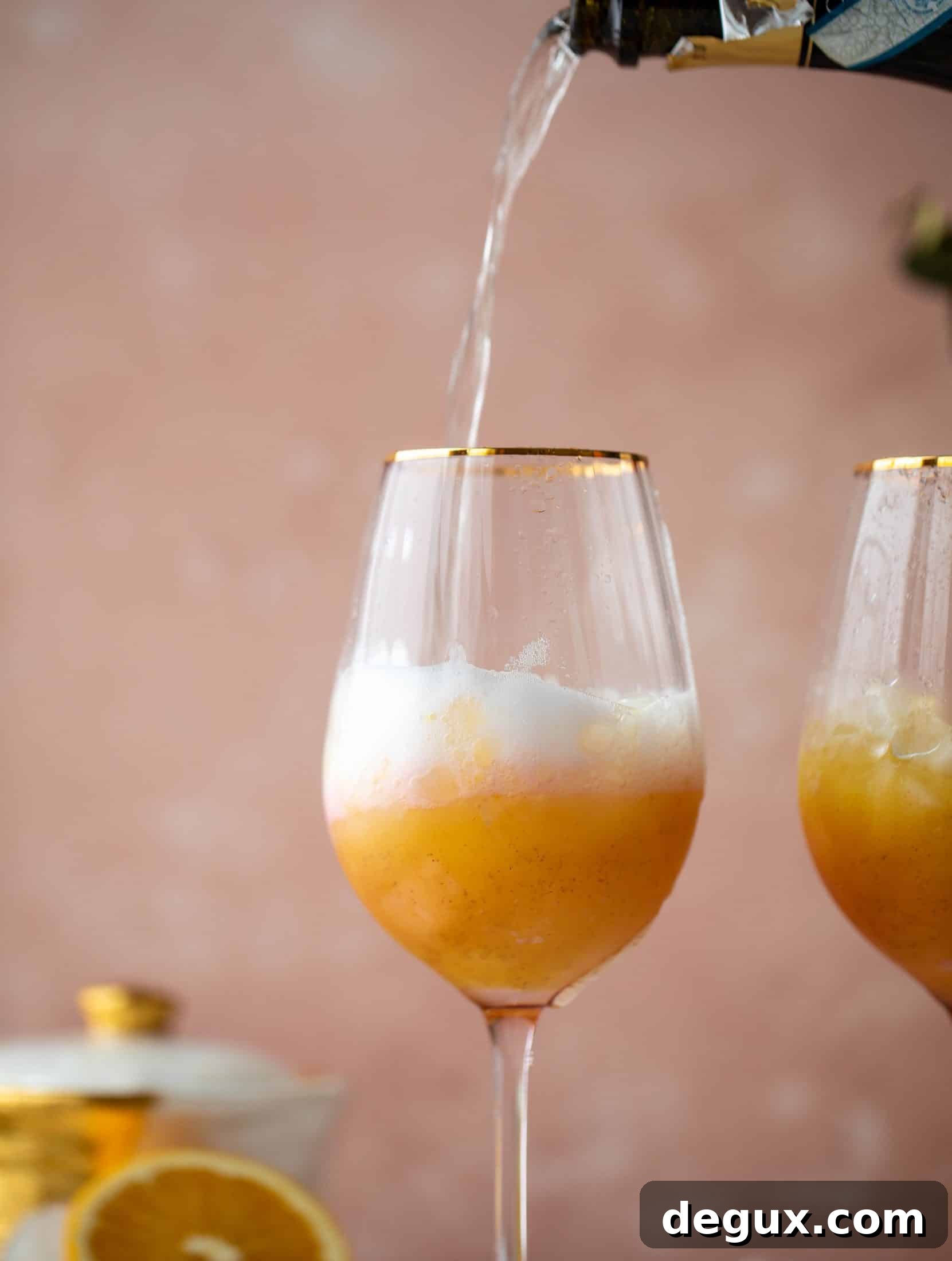 The spiced orange spritzer is a fancier mimosa and similar to an aperol spritz! A fresh spiced orange juice based mixed with prosecco and seltzer. So good!