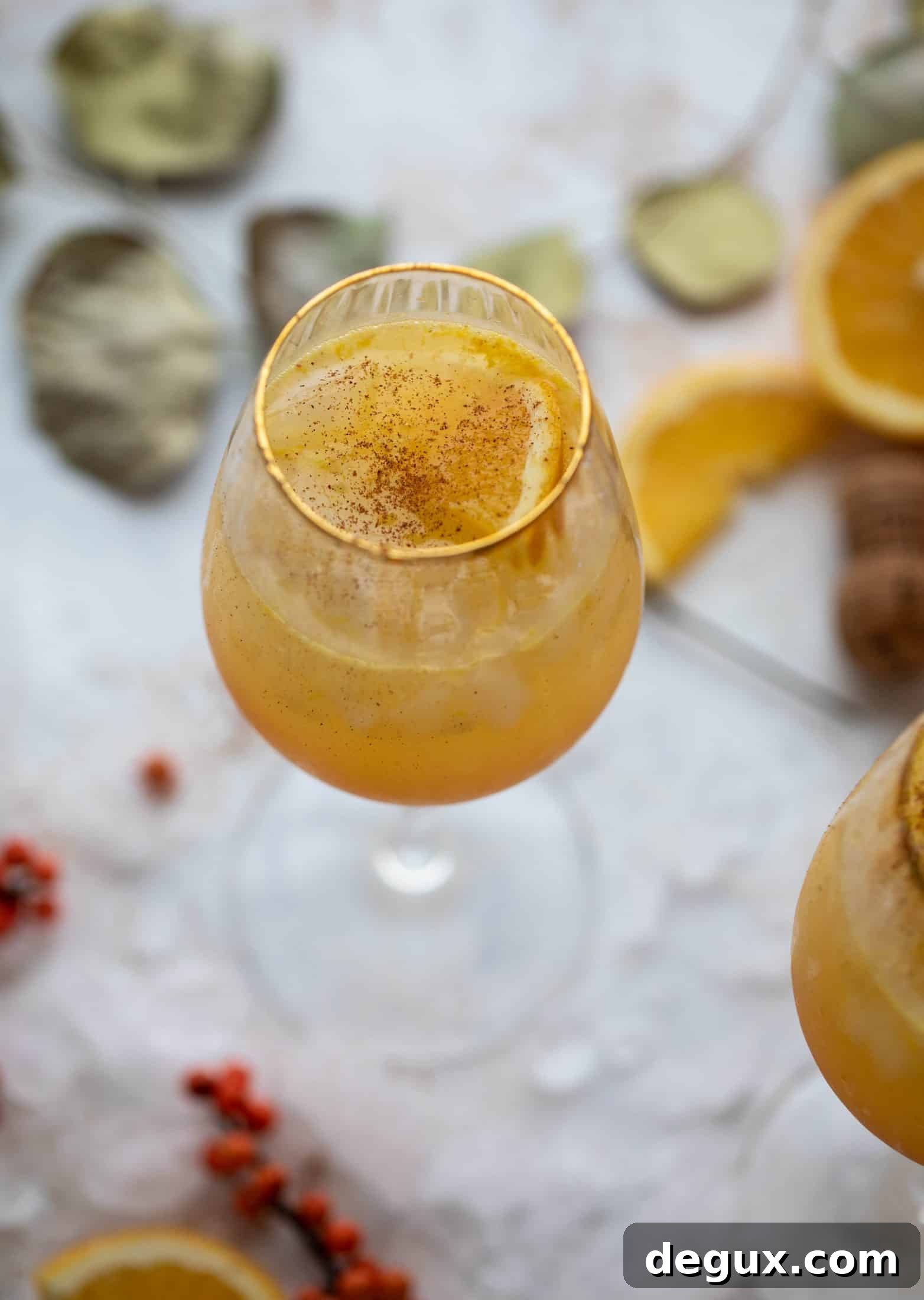 The spiced orange spritzer is a fancier mimosa and similar to an aperol spritz! A fresh spiced orange juice based mixed with prosecco and seltzer. So good!