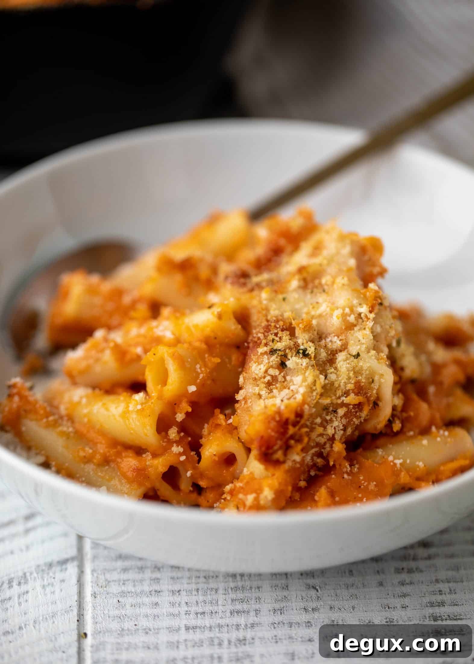 Butternut squash baked ziti is the ultimate comfort food! Squash, fire roasted tomatoes, parmesan and mozzarella make the best sauce ever.