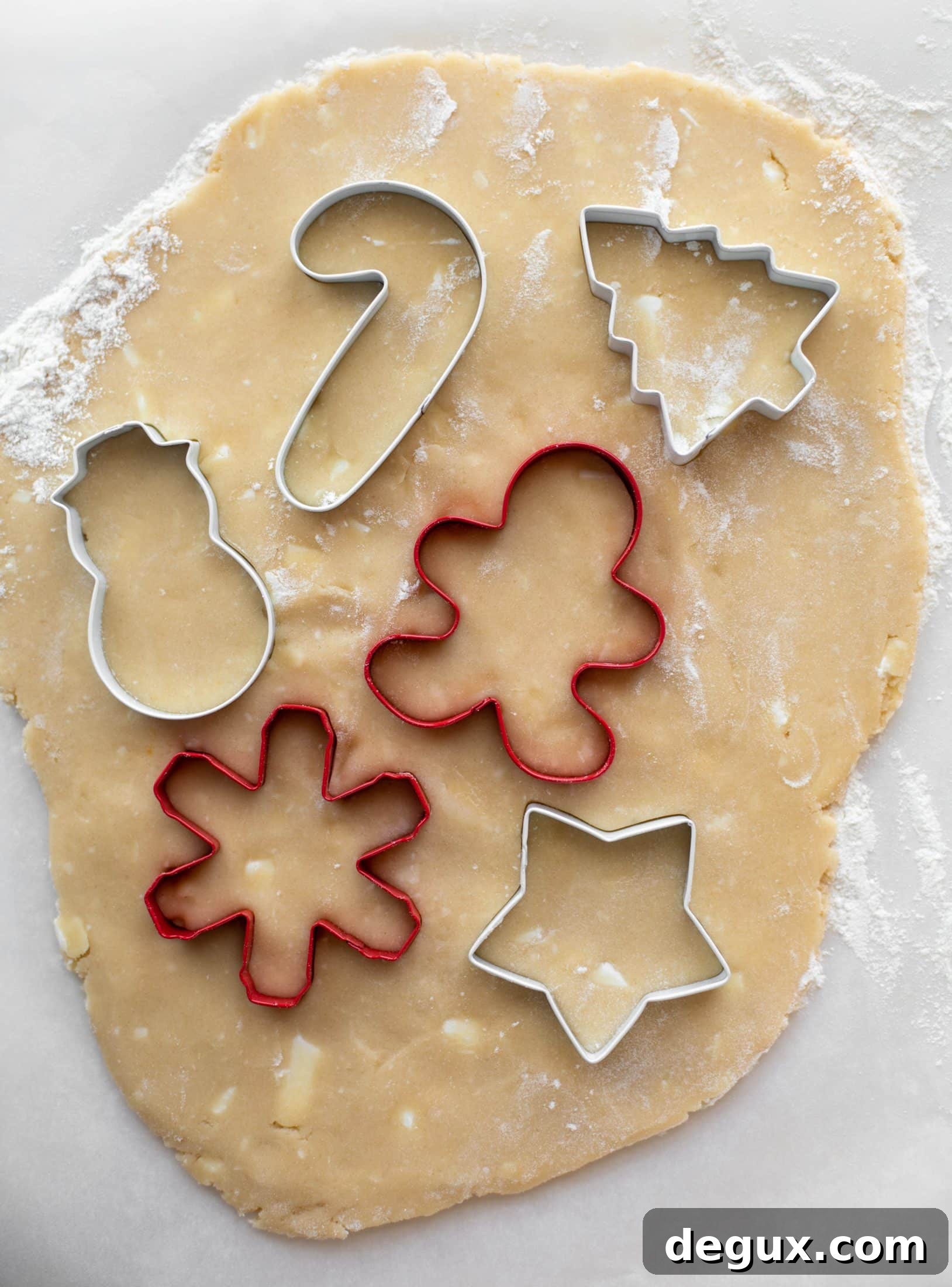 Pink Peppermint Sugar Cookie Recipe for Holiday Baking 4 Pink peppermint sugar cookies are classic vanilla cut out cookies topped with peppermint cream cheese frosting. They are delicious!