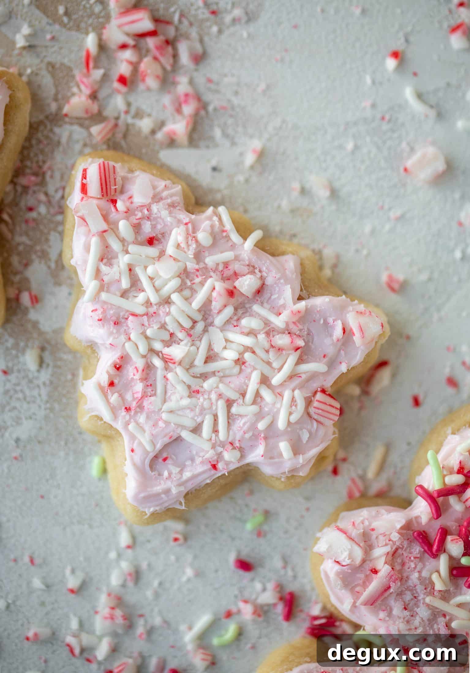 Pink Peppermint Sugar Cookie Recipe for Holiday Baking 9 Pink peppermint sugar cookies are classic vanilla cut out cookies topped with peppermint cream cheese frosting. They are delicious!