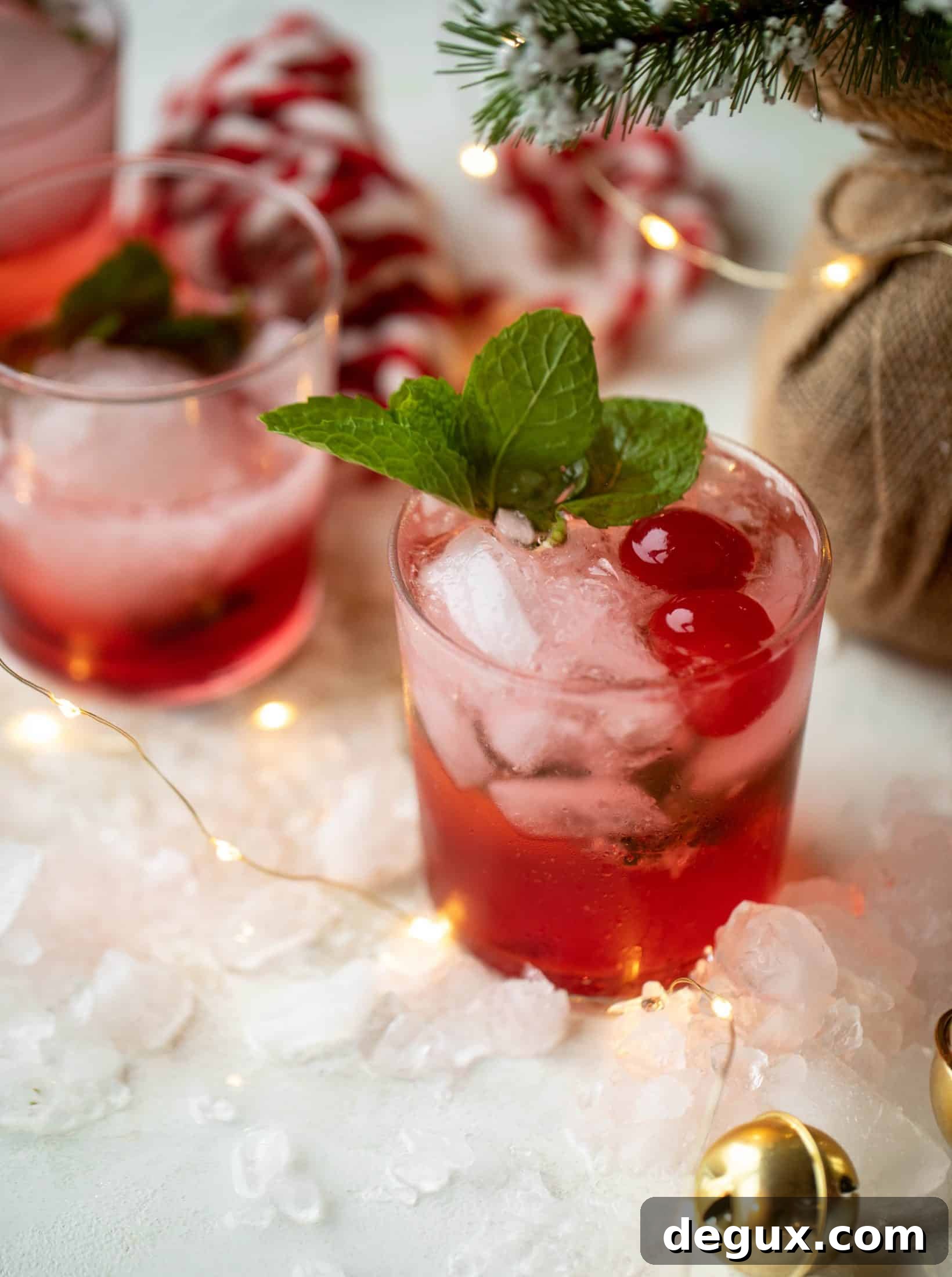 The merry cherry christmas cocktail is here! Vodka and cherries and mint, oh my! This is such a fun drink that can be made into a punch. It's delicious!