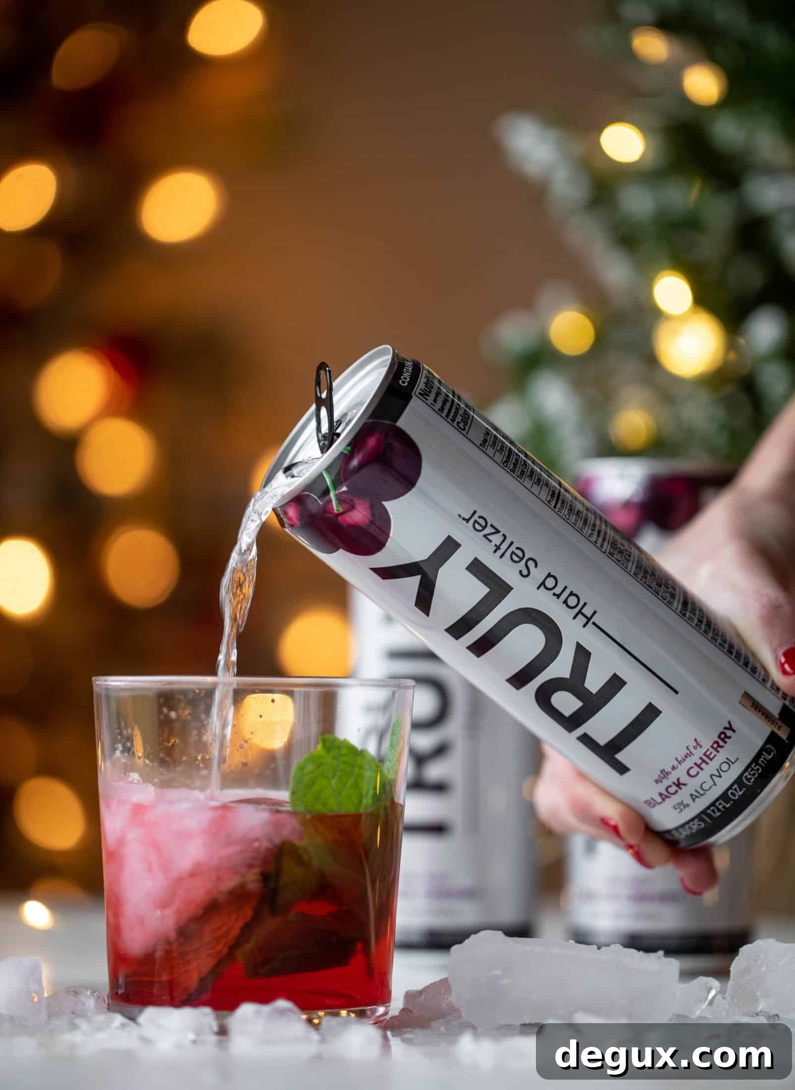 The merry cherry christmas cocktail is here! Vodka and cherries and mint, oh my! This is such a fun drink that can be made into a punch. It's delicious!