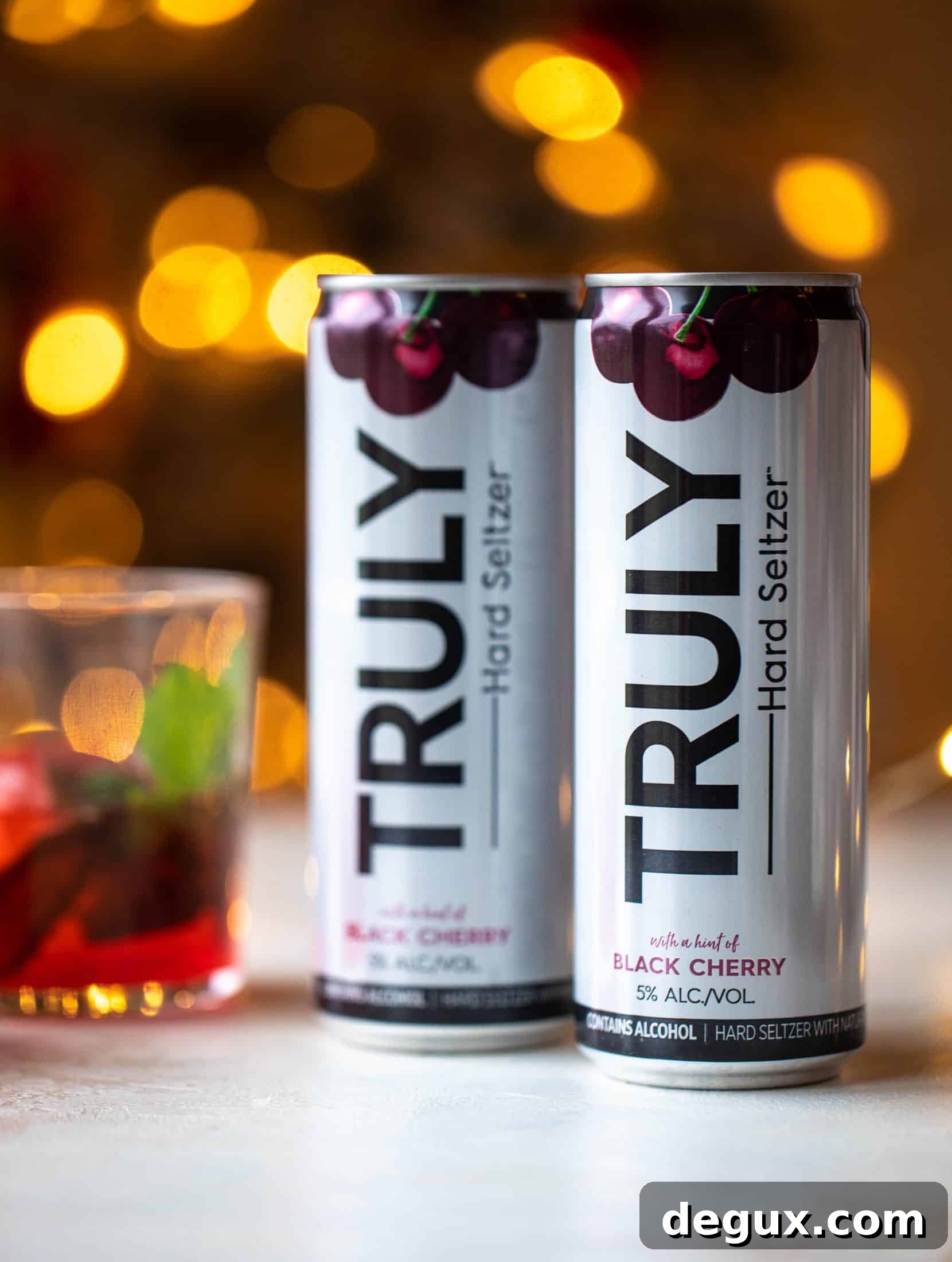 The merry cherry christmas cocktail is here! Vodka and cherries and mint, oh my! This is such a fun drink that can be made into a punch. It's delicious!
