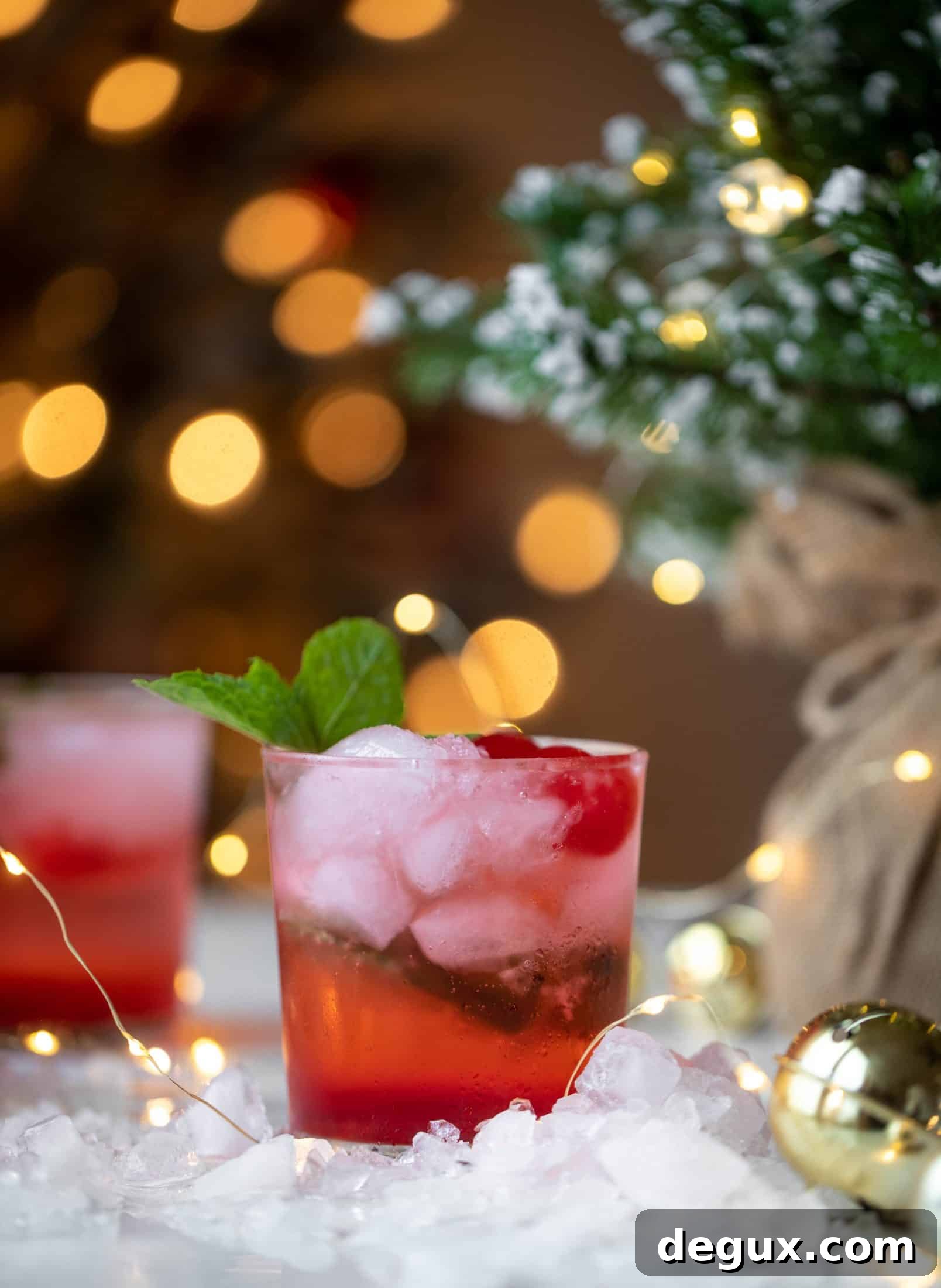 The merry cherry christmas cocktail is here! Vodka and cherries and mint, oh my! This is such a fun drink that can be made into a punch. It's delicious!