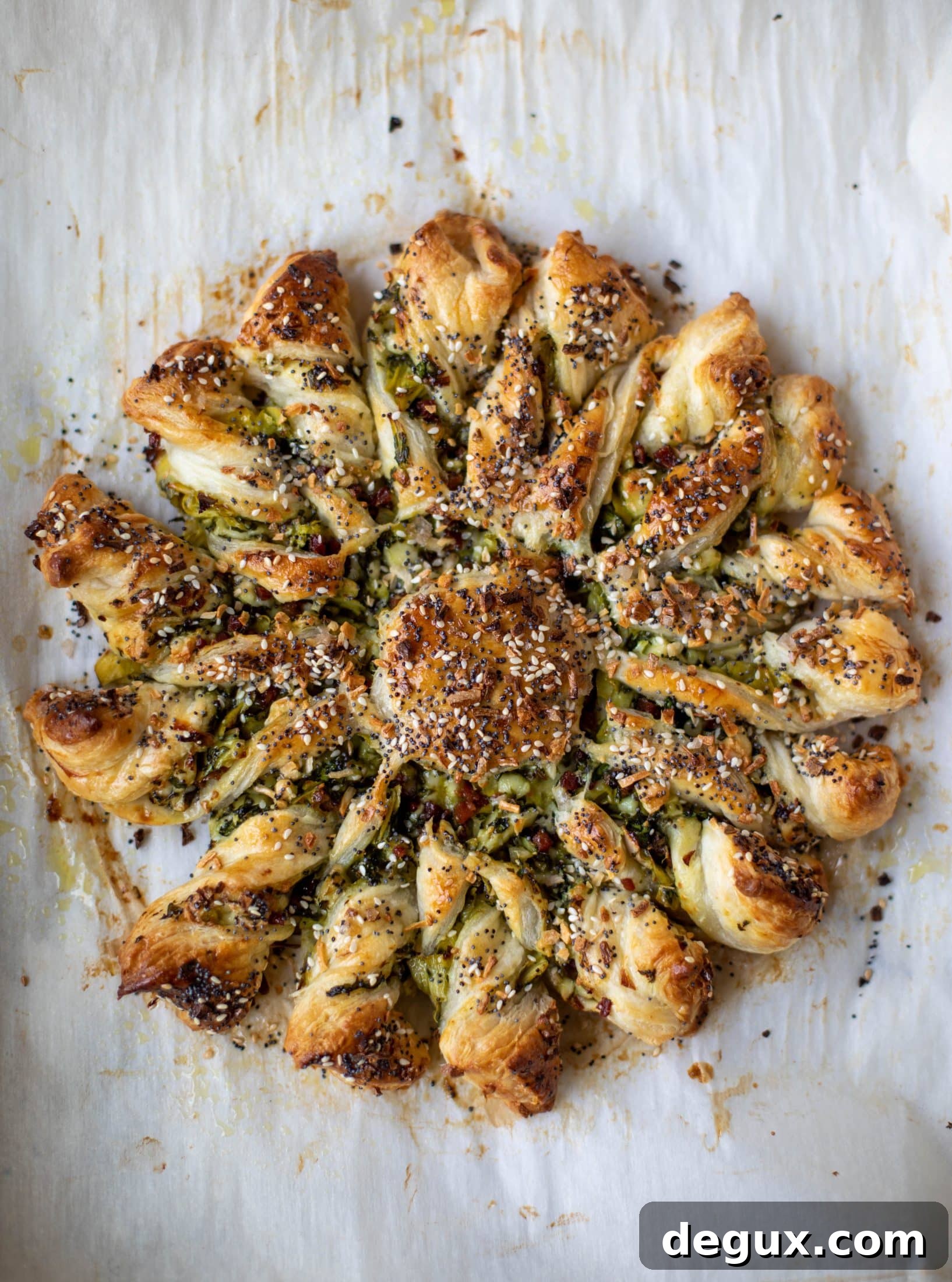 These spinach artichoke twists are filled with cheese and pancetta. They are buttery and flaky on the outside then sprinkled with everything seasoning. YUM.