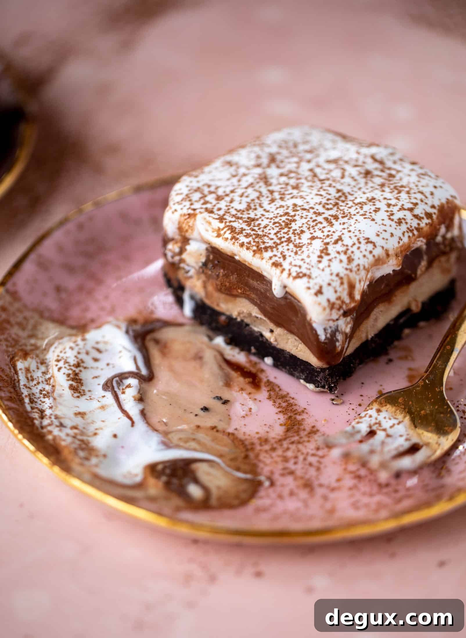 This frozen chocolate cookie dessert is a twist on the classic 90s recipe! Cookie crust, ice cream, homemade hot fudge and whipped cream. It's amazing!