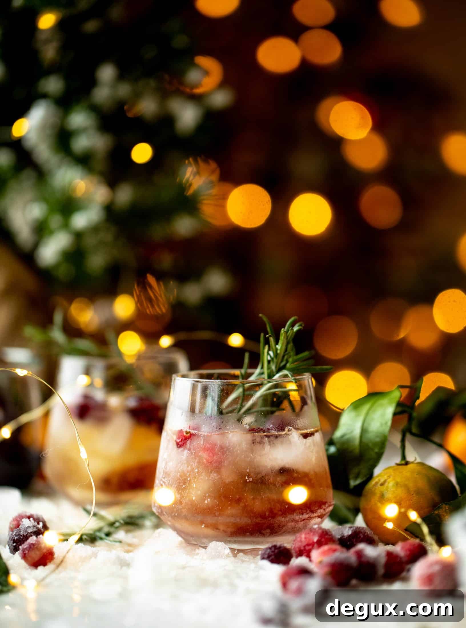 The mistletoe manhattan is a fun holiday spin on the classic manhattan cocktail! Sugared cranberries and rosemary make this super festive.