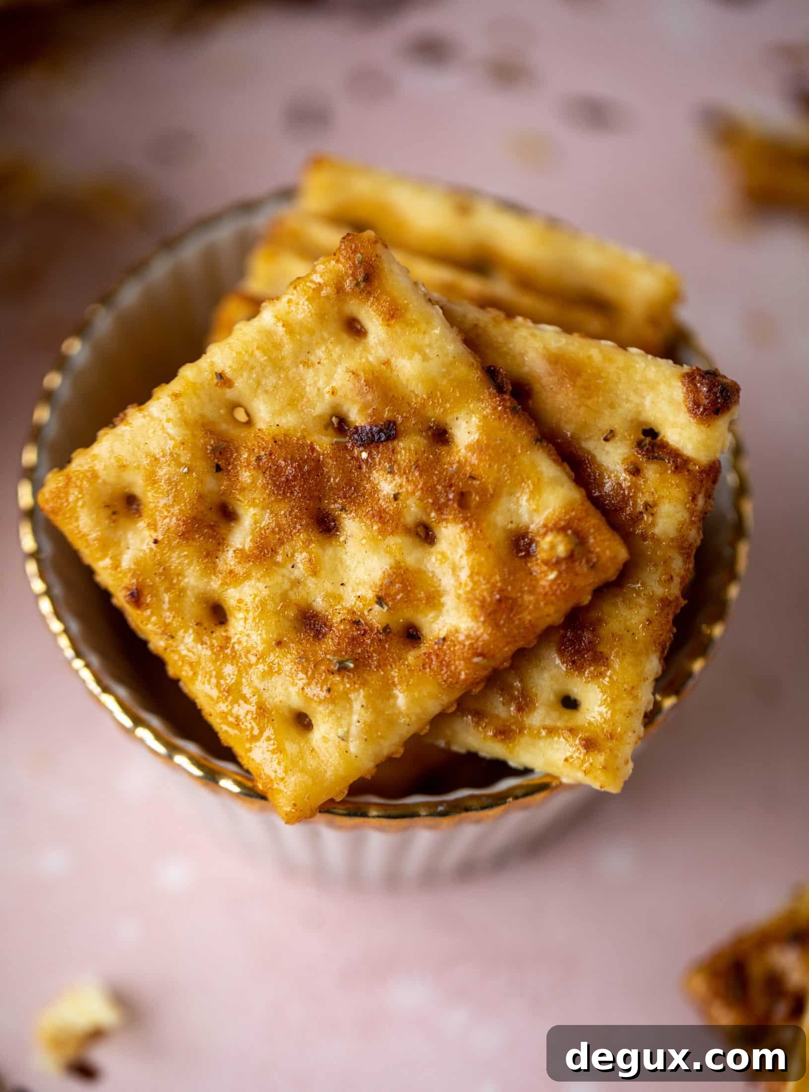 These super easy fire crackers are such a simple recipe to make! Bake the crackers with spice and butter for the perfect party snack.