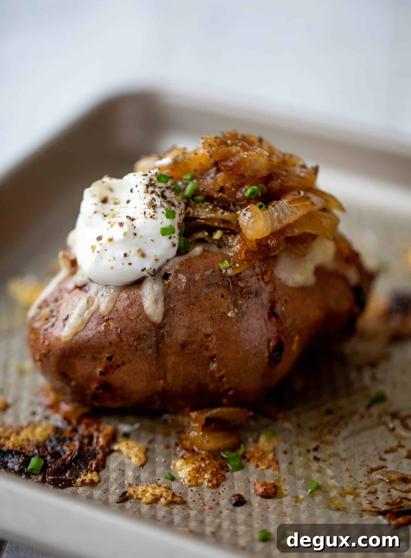 French Onion Stuffed Sweet Potatoes with Thyme Breadcrumb Crunch 2 These french onion stuffed sweet potatoes are slow roasted and topped with gruyere cheese and caramelized onions. Garlic butter bread crumbs finish them!