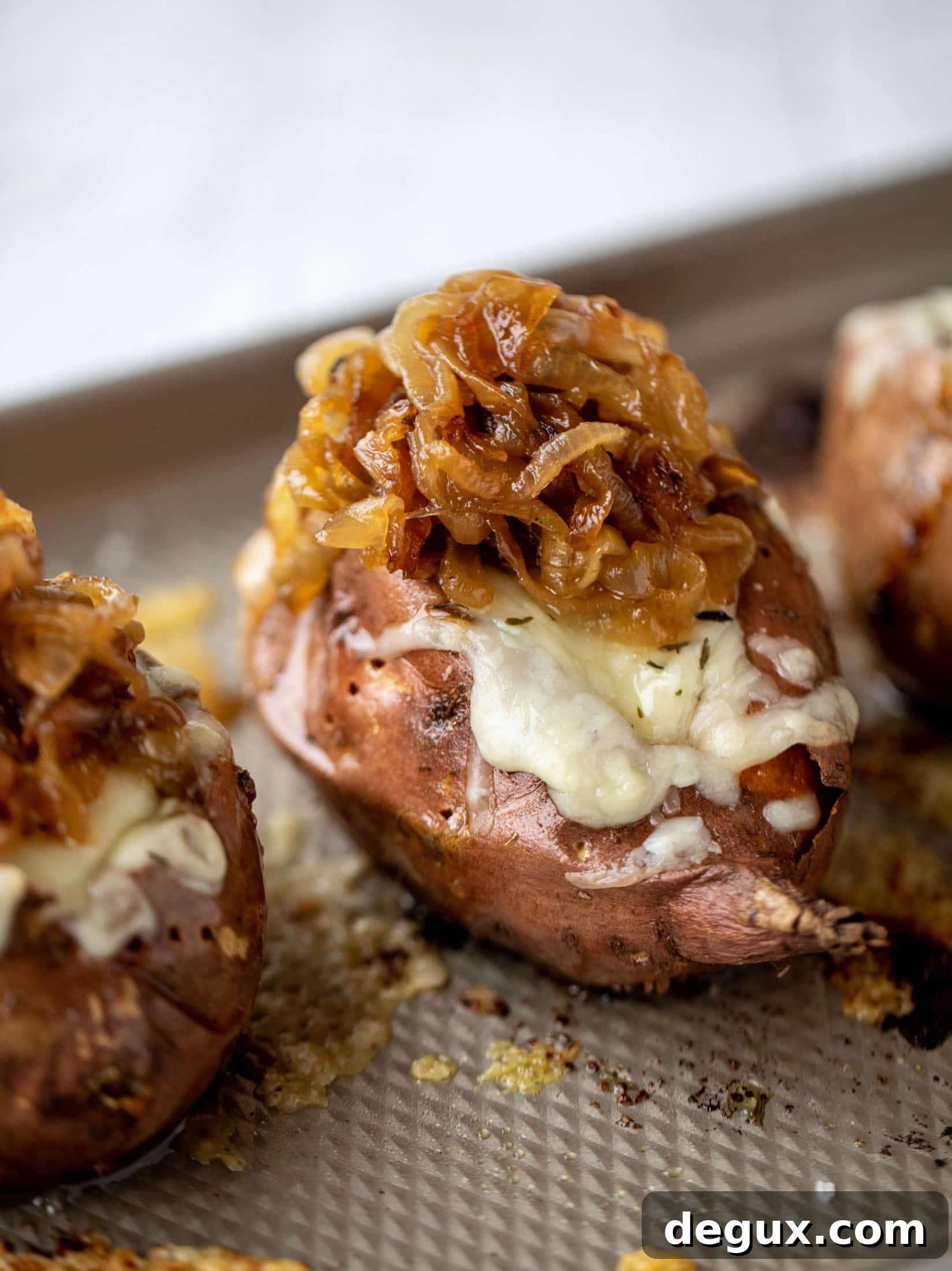 French Onion Stuffed Sweet Potatoes with Thyme Breadcrumb Crunch 6 These french onion stuffed sweet potatoes are slow roasted and topped with gruyere cheese and caramelized onions. Garlic butter bread crumbs finish them!