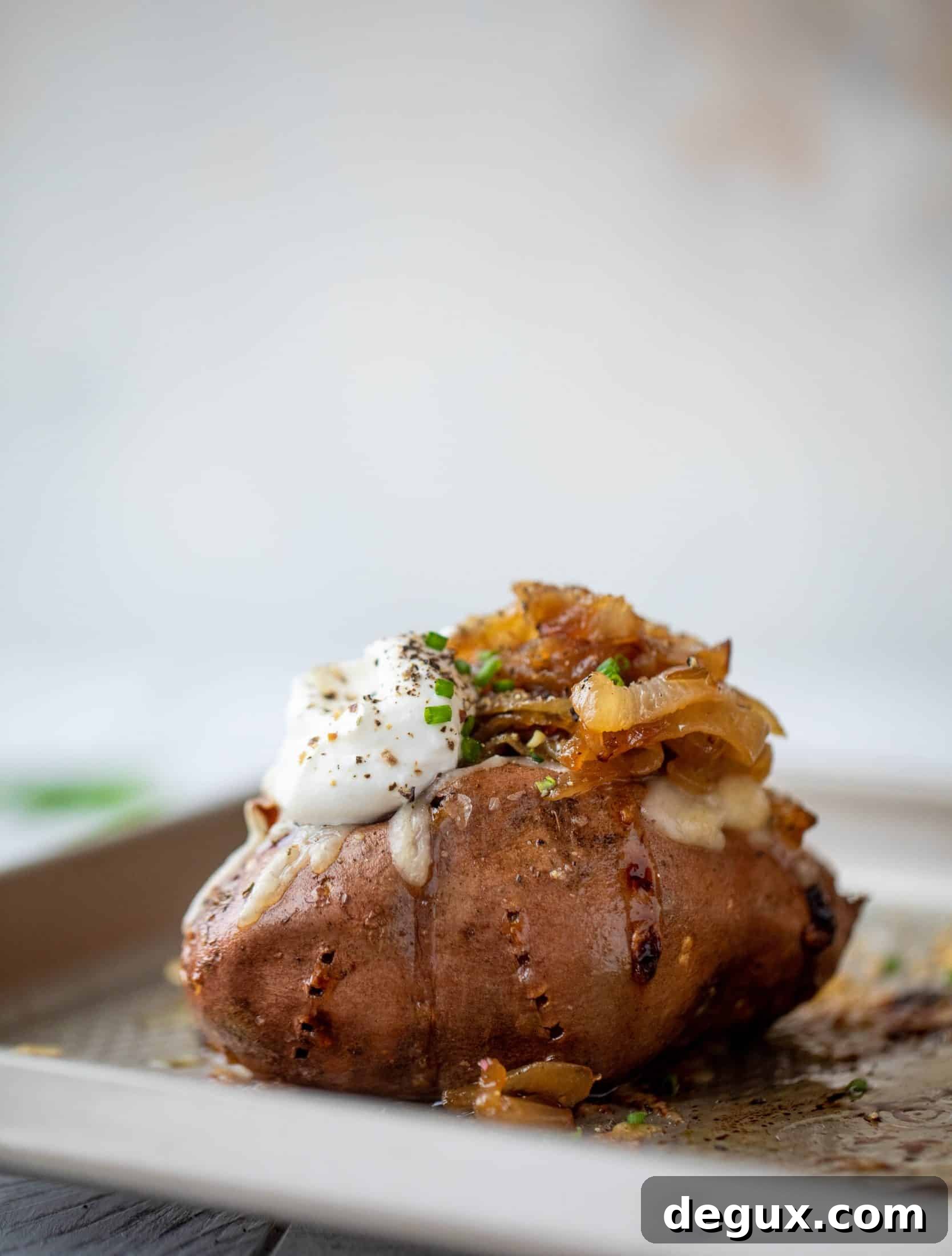 French Onion Stuffed Sweet Potatoes with Thyme Breadcrumb Crunch 7 These french onion stuffed sweet potatoes are slow roasted and topped with gruyere cheese and caramelized onions. Garlic butter bread crumbs finish them!